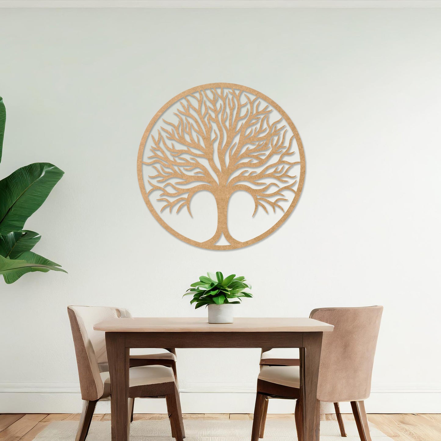 Circular wall art featuring a detailed tree design with spreading branches, symbolising life and growth. This piece is displayed on a neutral wall in a modern room, complementing the elegant and contemporary decor.