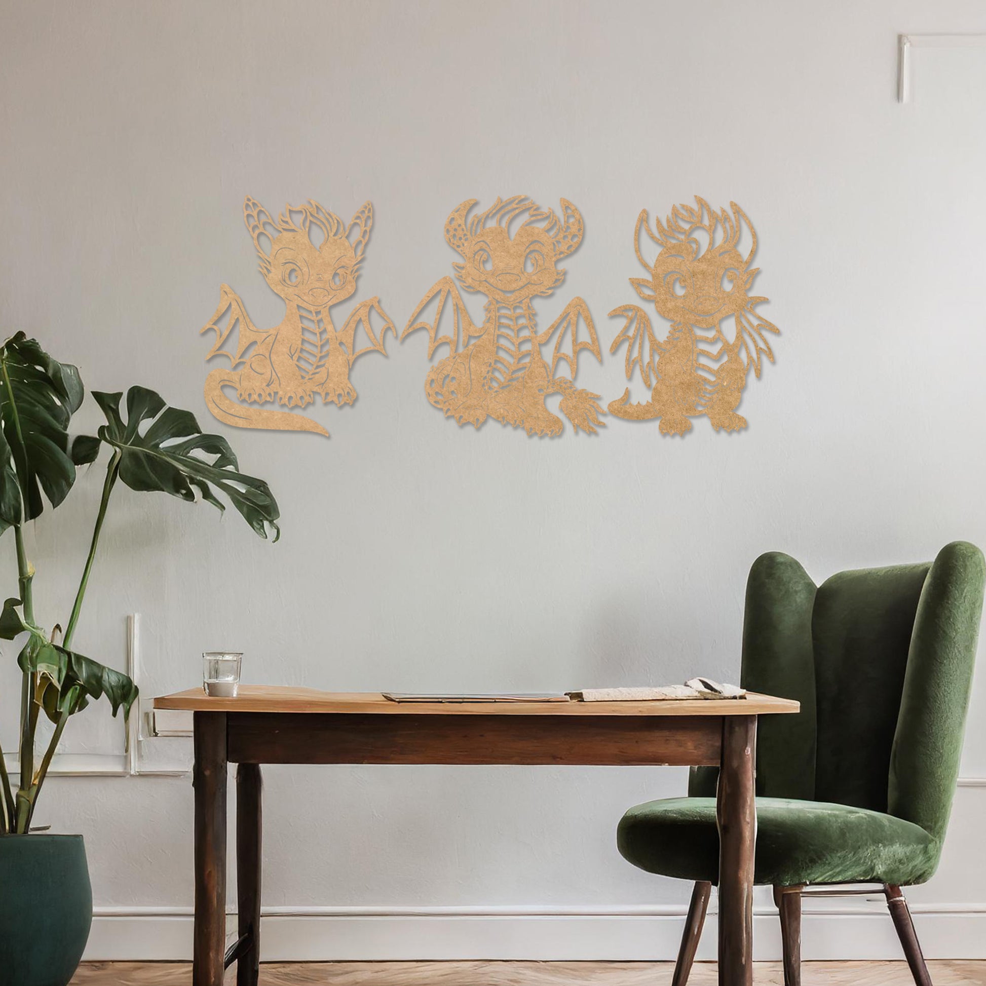 Wooden wall art design featuring three playful dragon characters, each with different poses and expressions, placed on a neutral wall within modern room decor. The design brings whimsy and charm with detailed features and lively energy.