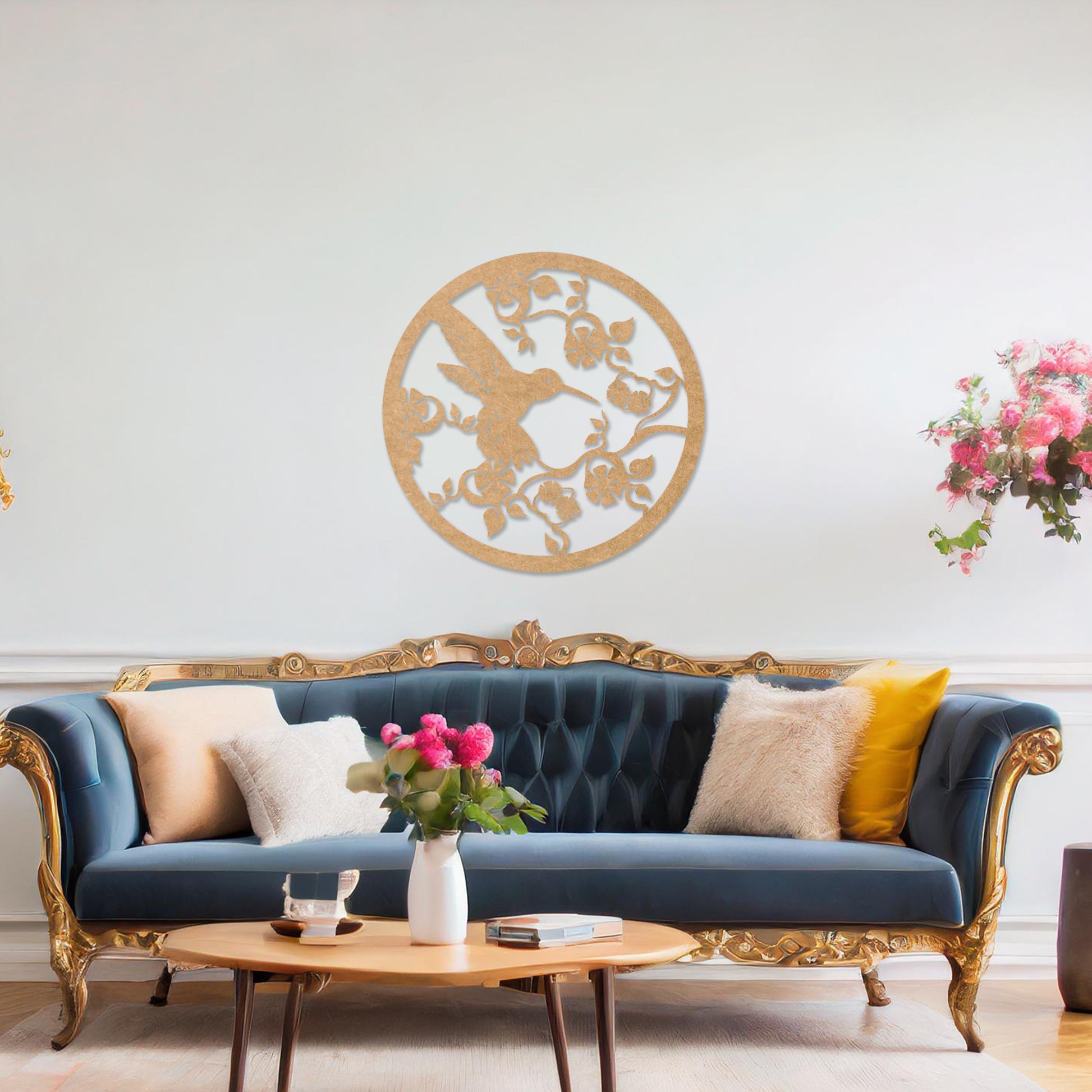 Wooden wall art design featuring a hummingbird amidst flowers and vines, framed in a circular shape, placed on a neutral wall within modern room decor. The design captures the elegance of nature with intricate details.