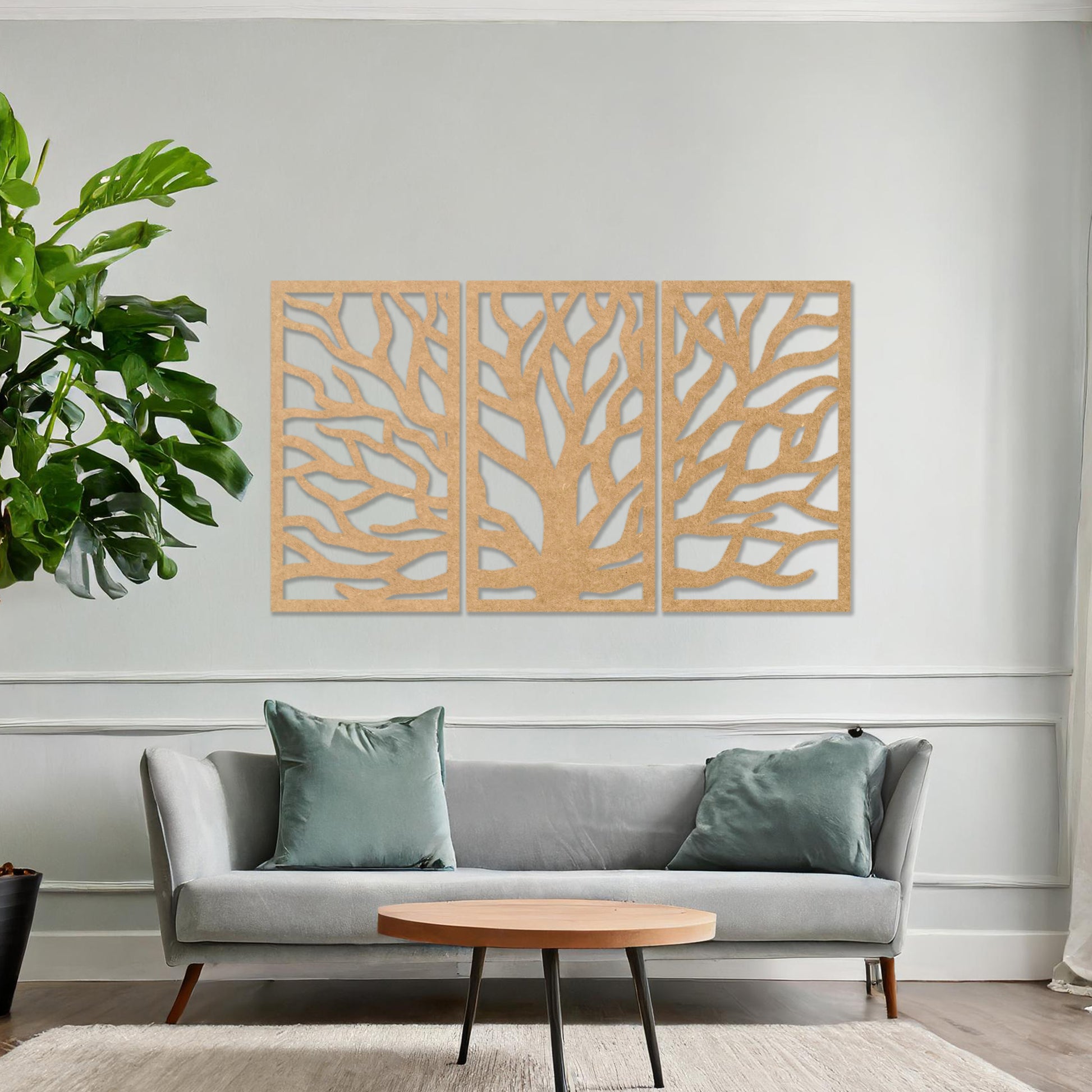 Wooden wall art consisting of three panels featuring an abstract tree branch design, displayed on a neutral wall within modern room decor, emphasising its artistic and contemporary appeal.