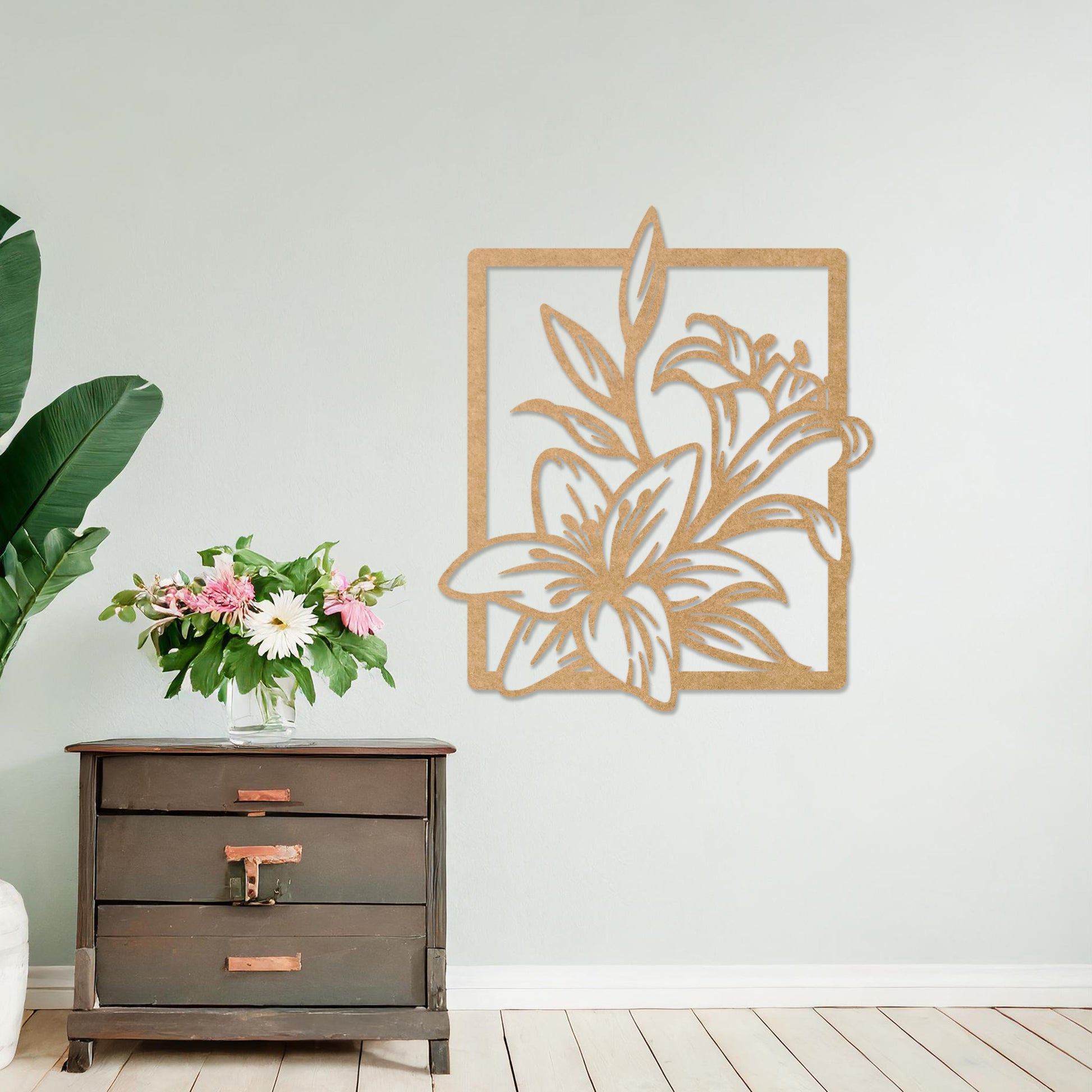 Wooden wall art featuring a delicate floral design with intricate details of lilies and leaves, placed on a neutral wall within a modern room decor, showcasing its elegant and timeless craftsmanship.