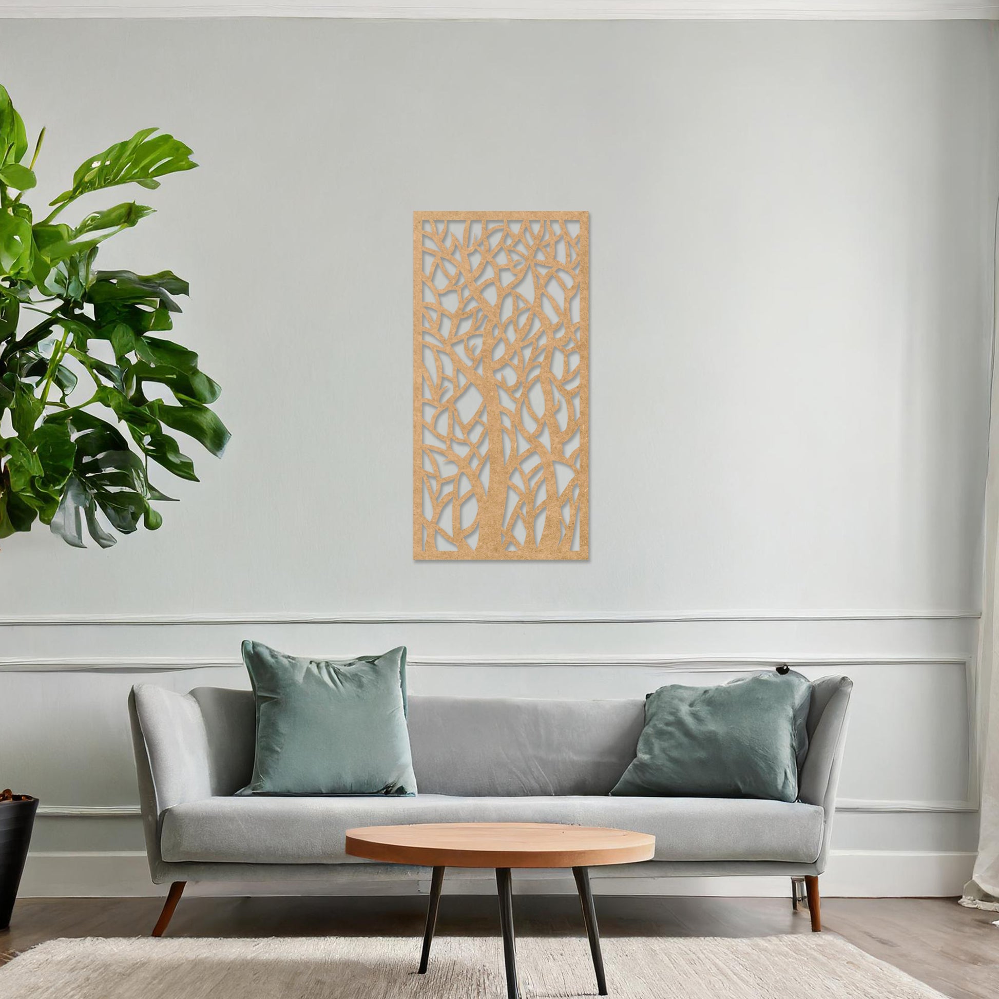 Wooden wall art featuring a vertical design of intertwined tree trunks and branches, displayed on a neutral wall within modern room decor, showcasing its intricate and artistic craftsmanship.