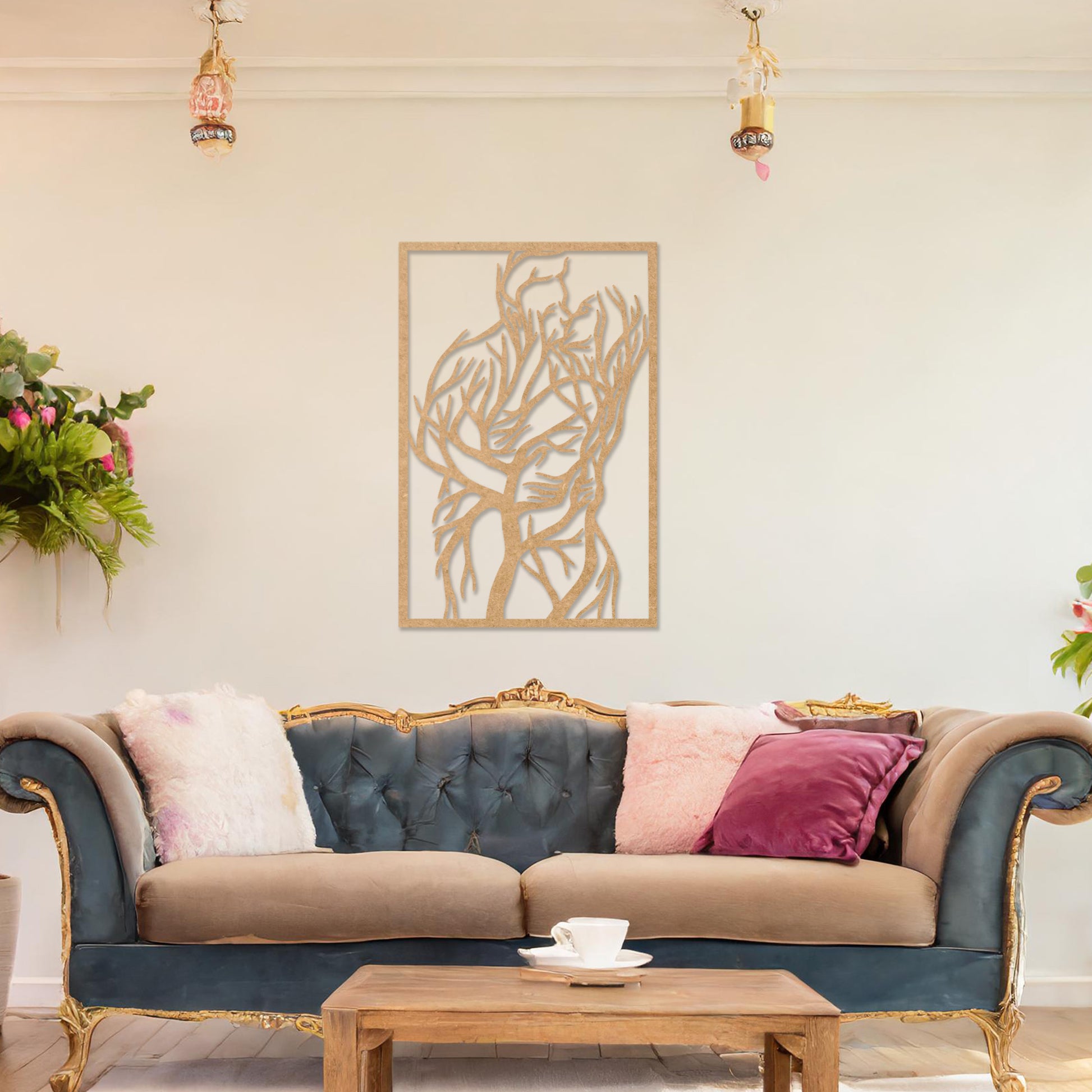 Wooden wall art featuring a rectangular design of two intertwined human figures stylised with tree branches, symbolising connection and unity. The artwork is displayed on a neutral wall within modern room decor, highlighting its artistic and emotional depth.