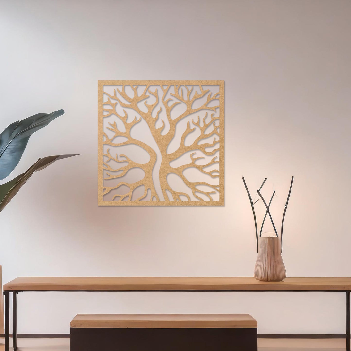 Square wall art featuring a stylised tree with intertwining branches, showcasing a modern and organic design. The artwork is displayed on a neutral wall in a contemporary living room with a sleek sofa and complementary decor.