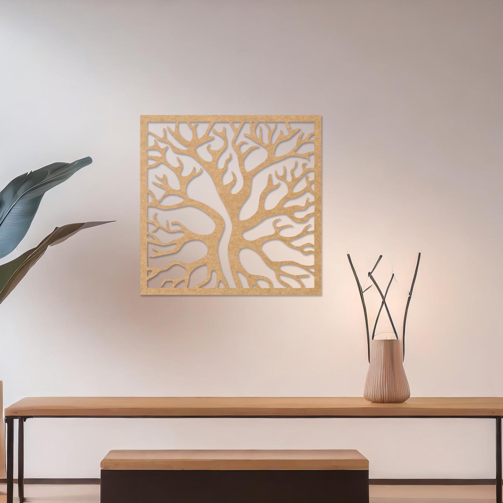Square wall art featuring a stylised tree with intertwining branches, showcasing a modern and organic design. The artwork is displayed on a neutral wall in a contemporary living room with a sleek sofa and complementary decor.