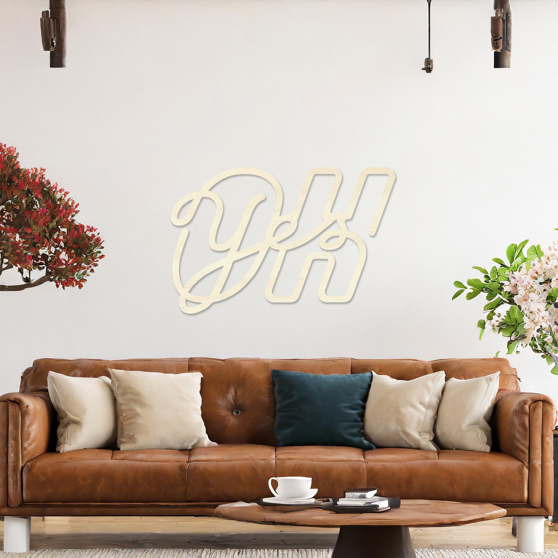 Wall art featuring the phrase "Oh Yes" in an elegant, flowing script combined with bold, block-style letters. The piece is displayed on a neutral wall within modern decor, adding a creative and playful touch to the space.