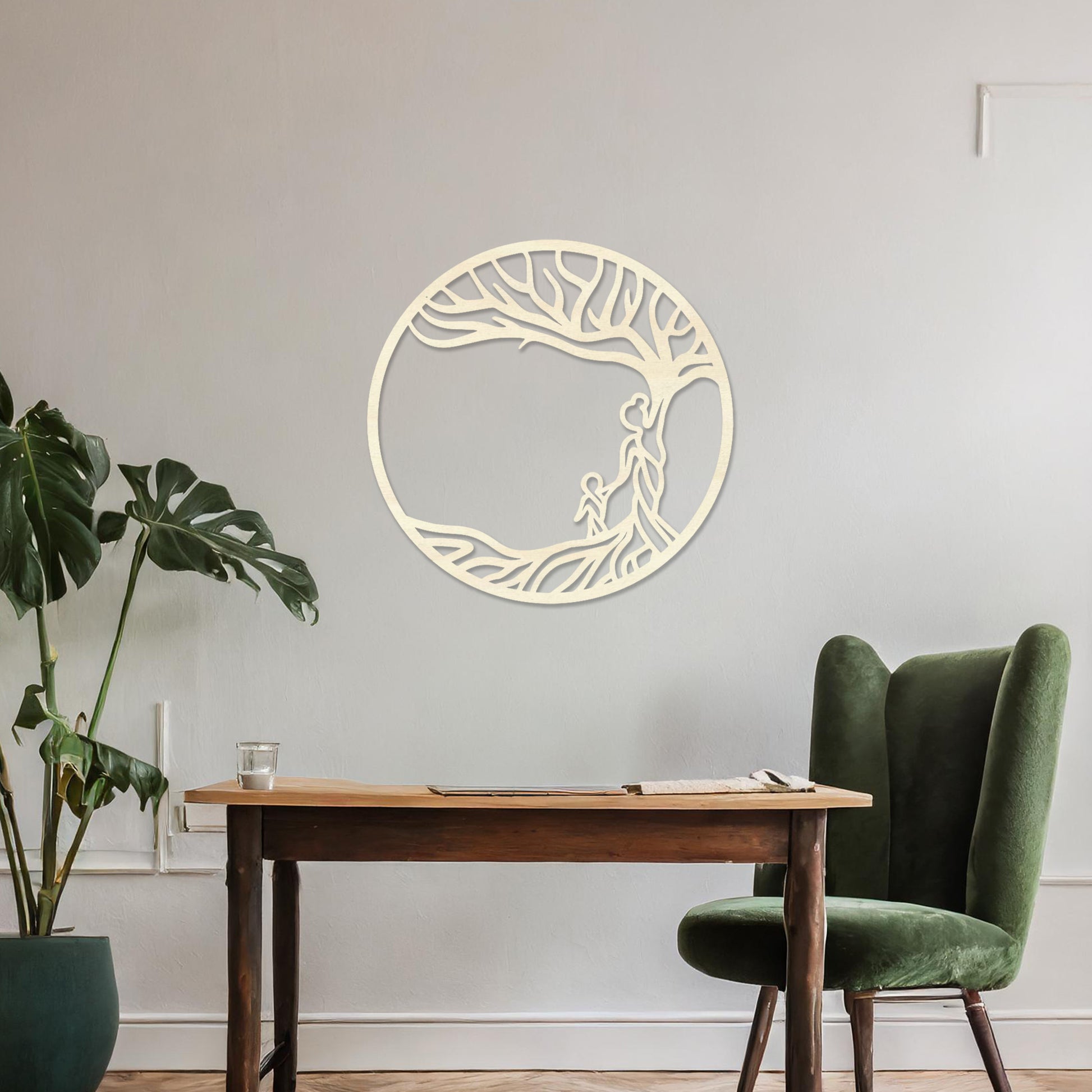 Wooden wall art featuring a circular design with a tree and two human figures under its branches, symbolising family and connection. The artwork is displayed on a neutral wall within modern room decor, highlighting its meaningful design.