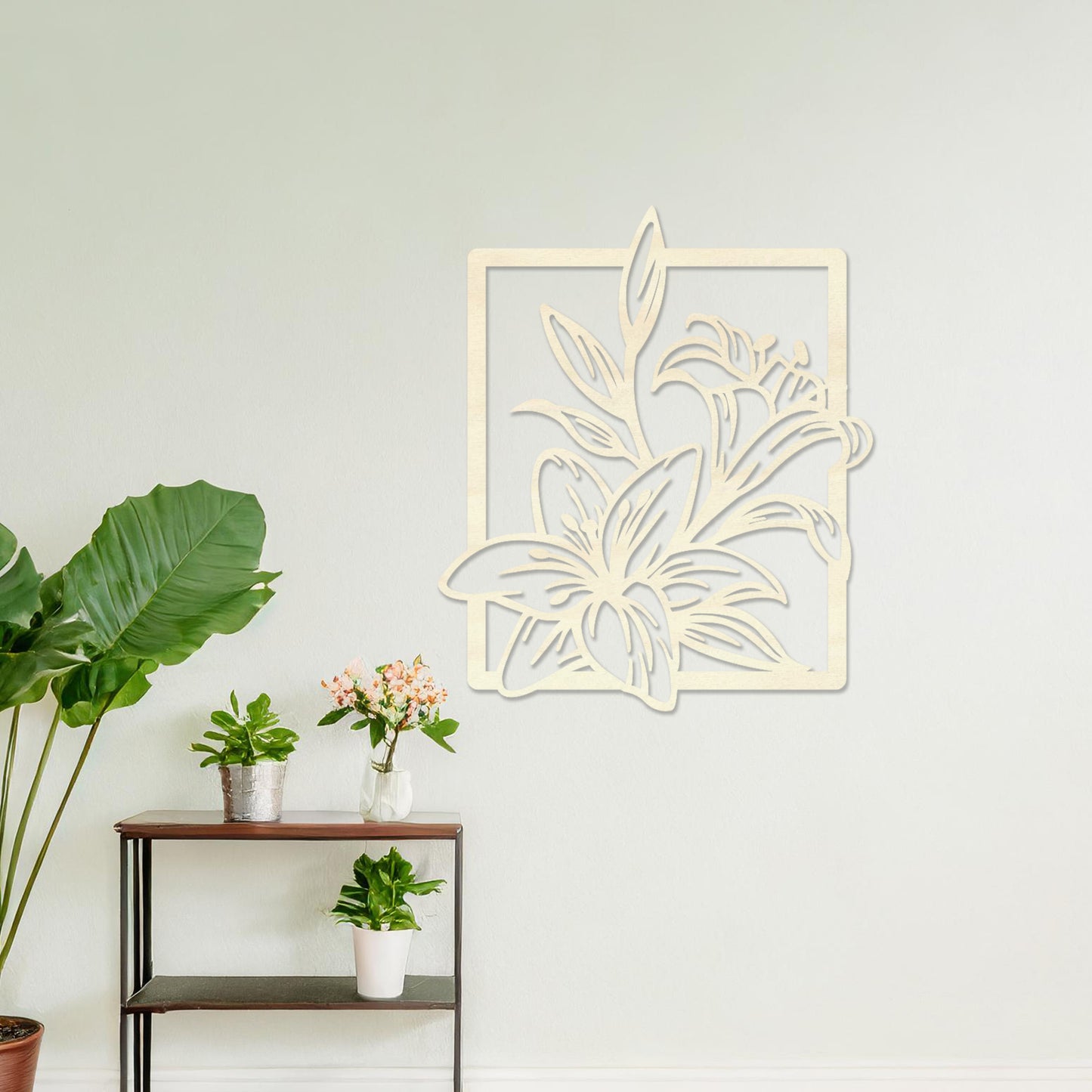 Wooden wall art featuring a delicate floral design with intricate details of lilies and leaves, placed on a neutral wall within a modern room decor, showcasing its elegant and timeless craftsmanship.