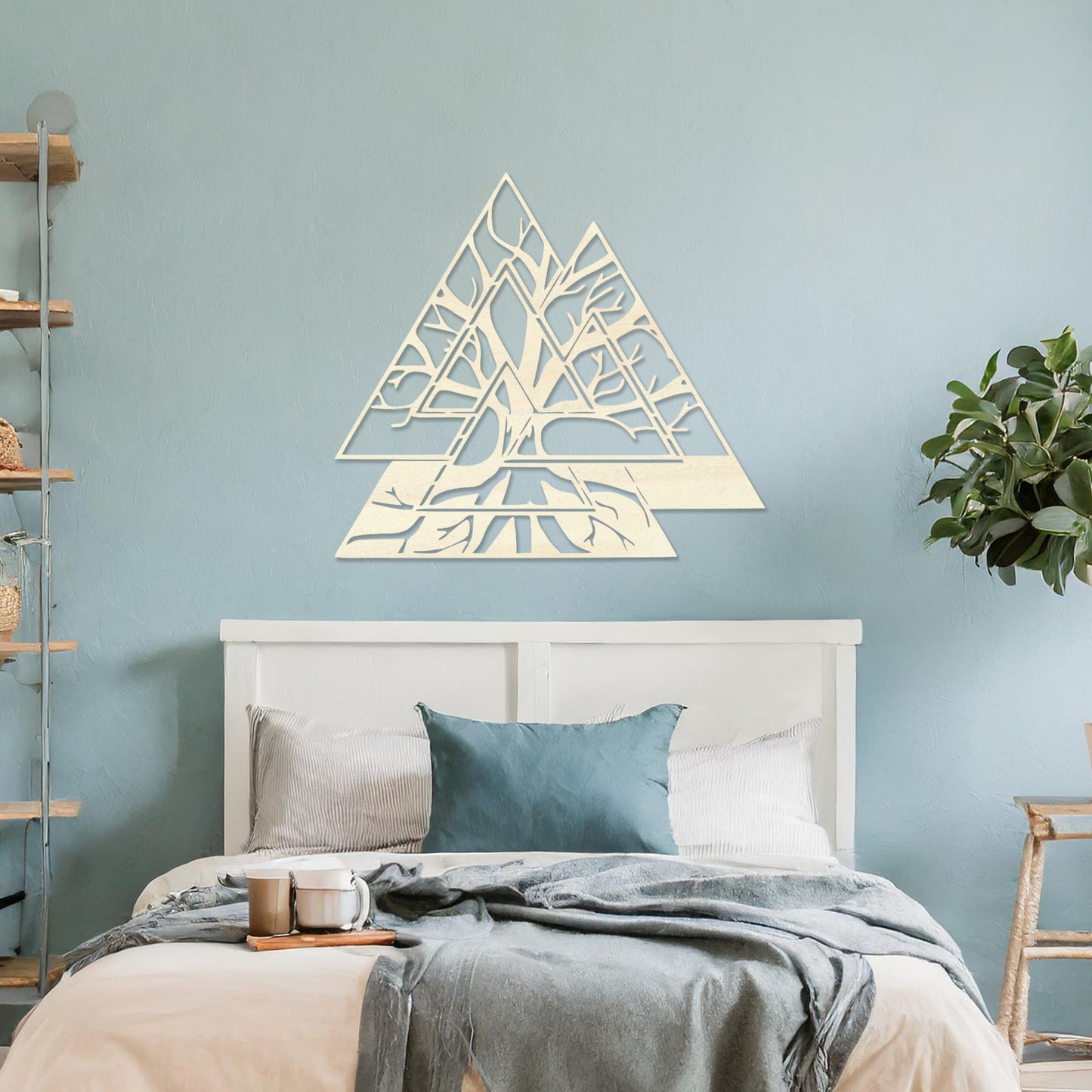 Wooden wall art design featuring a geometric triangular shape with intricate tree branches interwoven inside, placed on a neutral wall within modern room decor. The design combines nature and geometry for a contemporary, artistic expression.