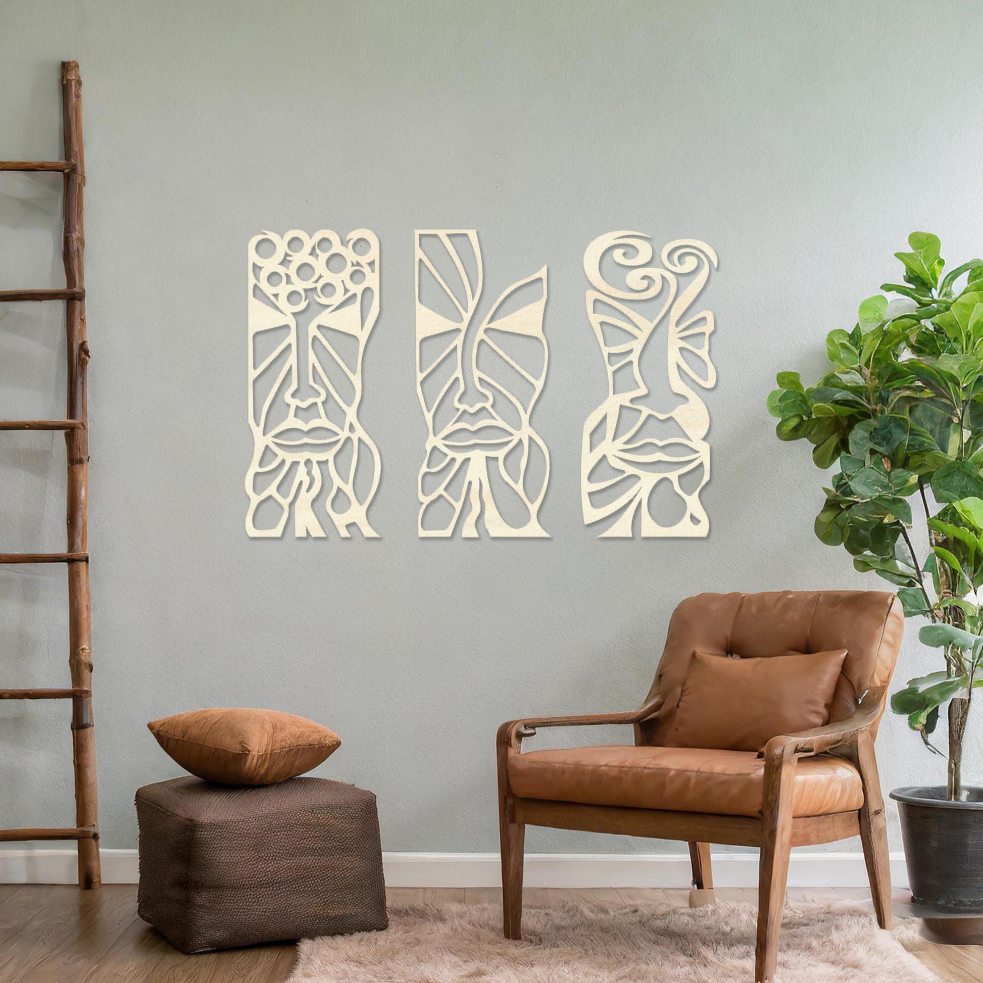 Wooden wall art set featuring three abstract face designs with intricate geometric and flowing patterns, displayed on a neutral wall within modern room decor, highlighting their artistic and contemporary appeal.