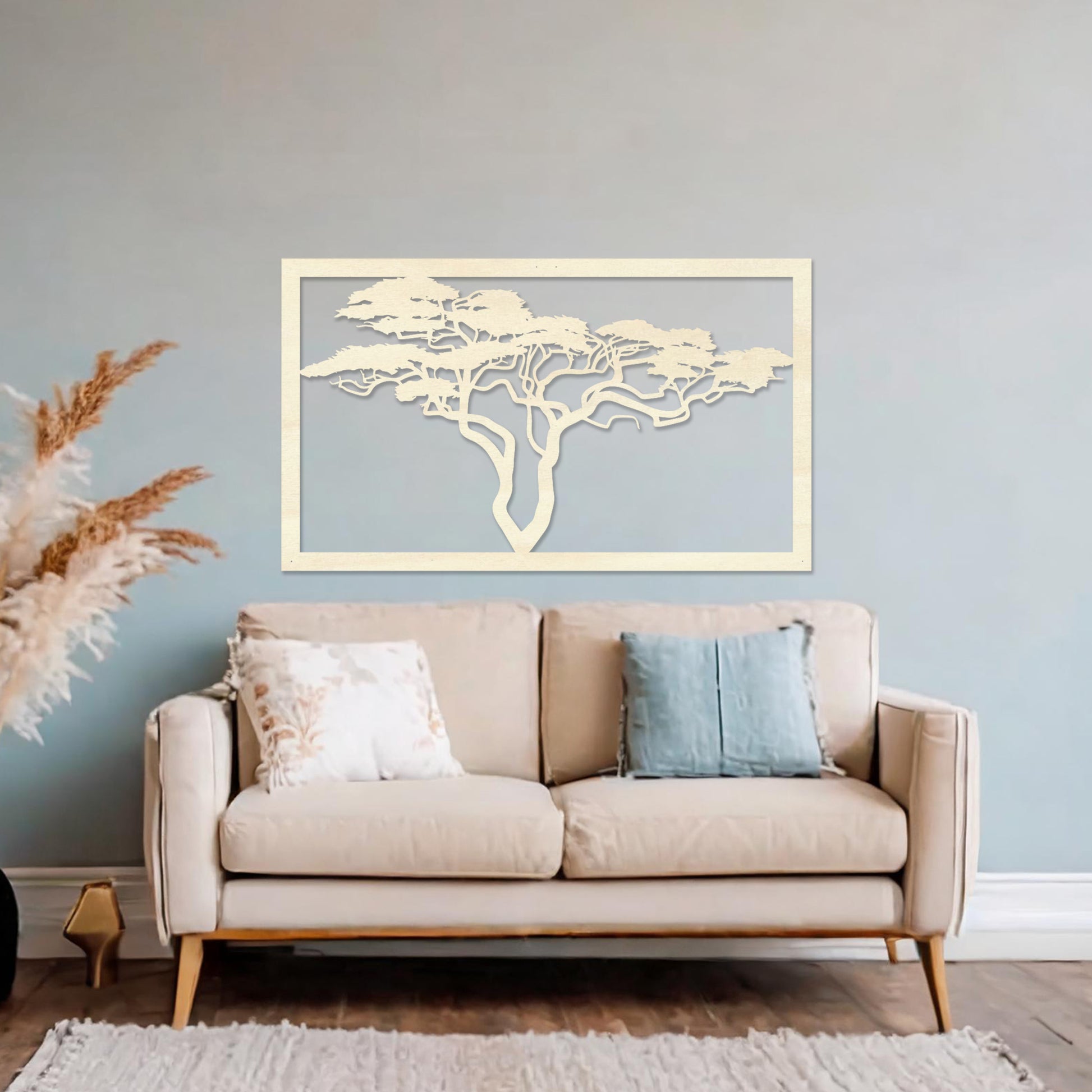Wooden wall art featuring a rectangular design with a detailed silhouette of a tree with sprawling branches. The artwork is displayed on a neutral wall within modern room decor, showcasing its natural and artistic elegance.