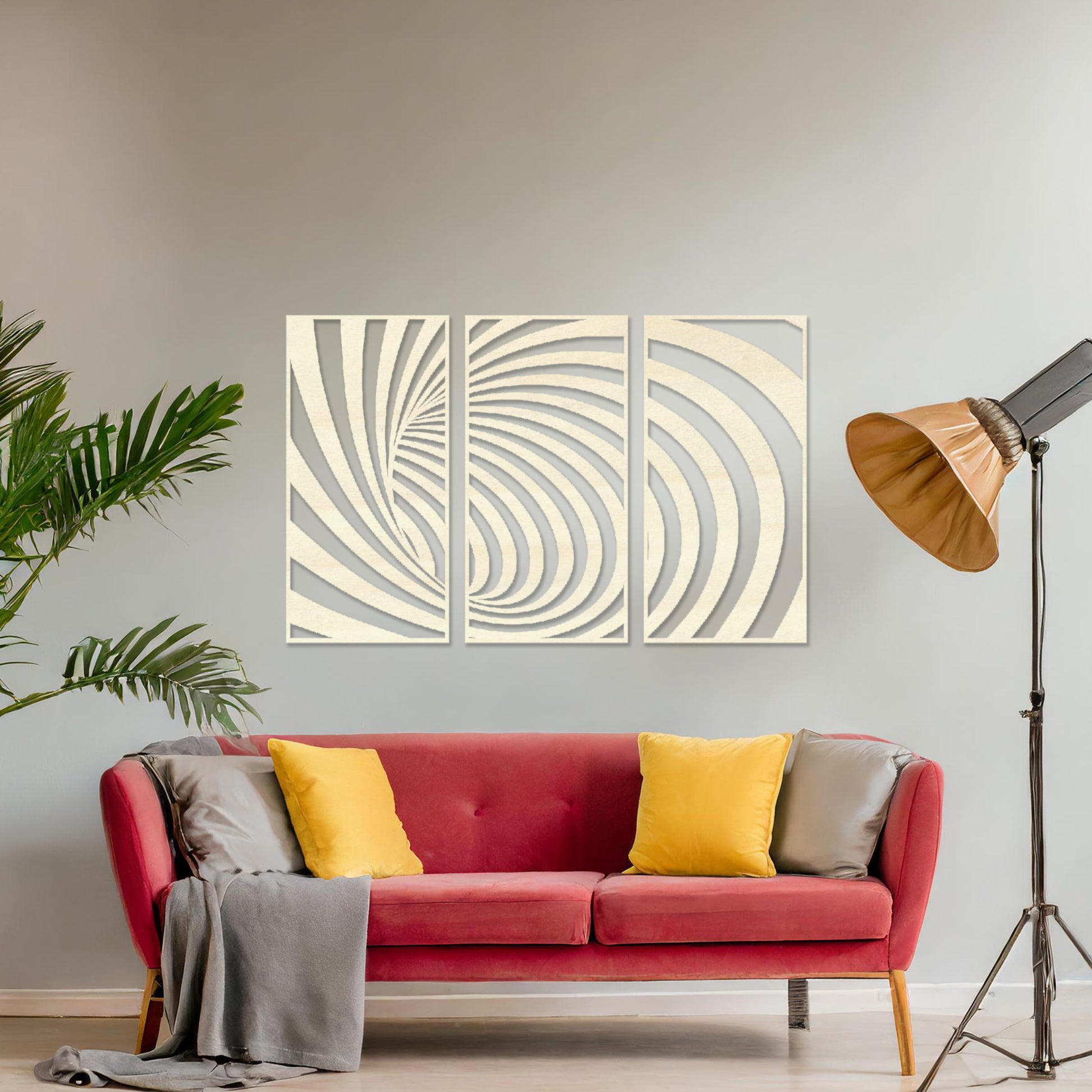 Wooden wall art comprising three panels with an abstract spiral design, displayed on a neutral wall within modern room decor, highlighting its bold and contemporary artistic craftsmanship.