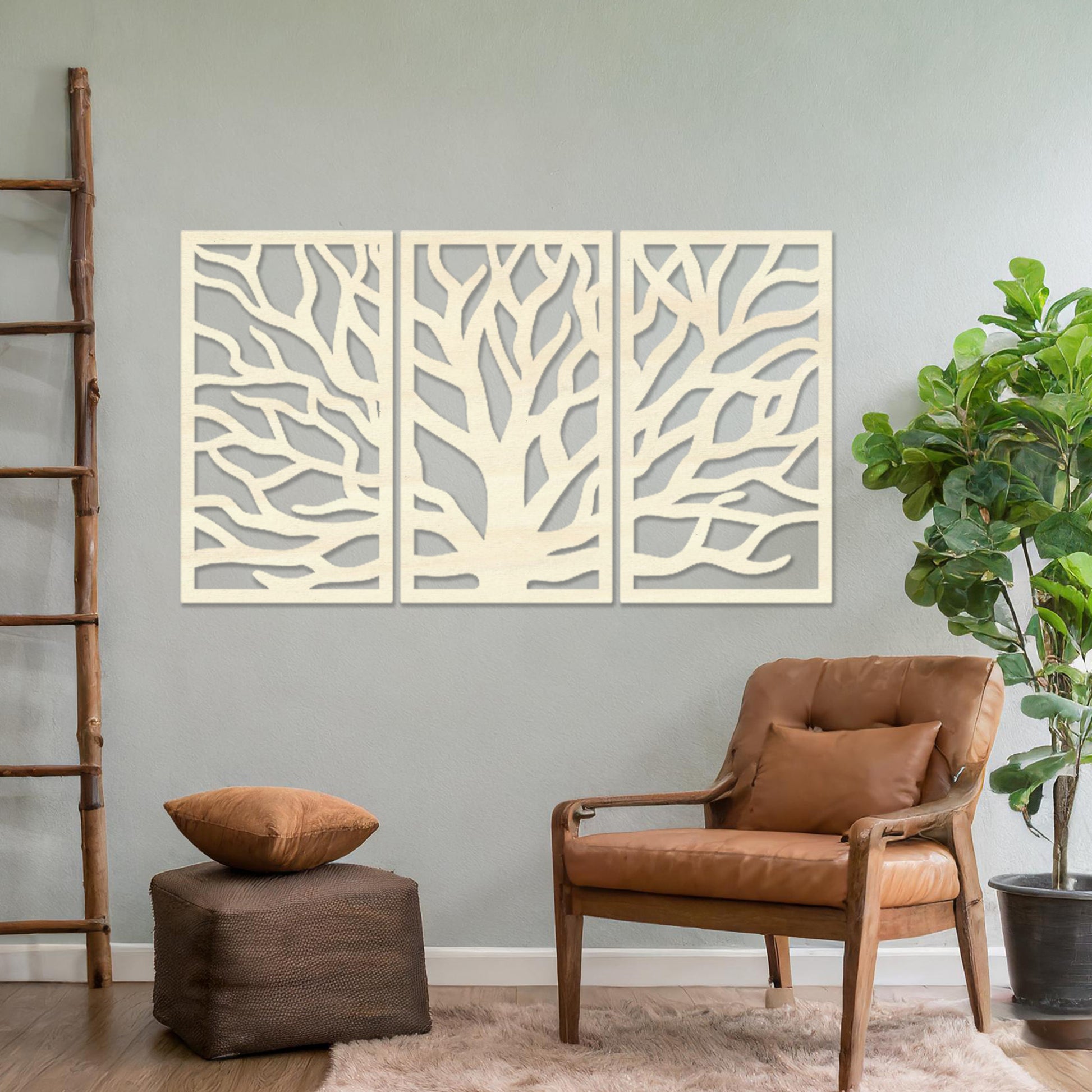 Wooden wall art consisting of three panels featuring an abstract tree branch design, displayed on a neutral wall within modern room decor, emphasising its artistic and contemporary appeal.
