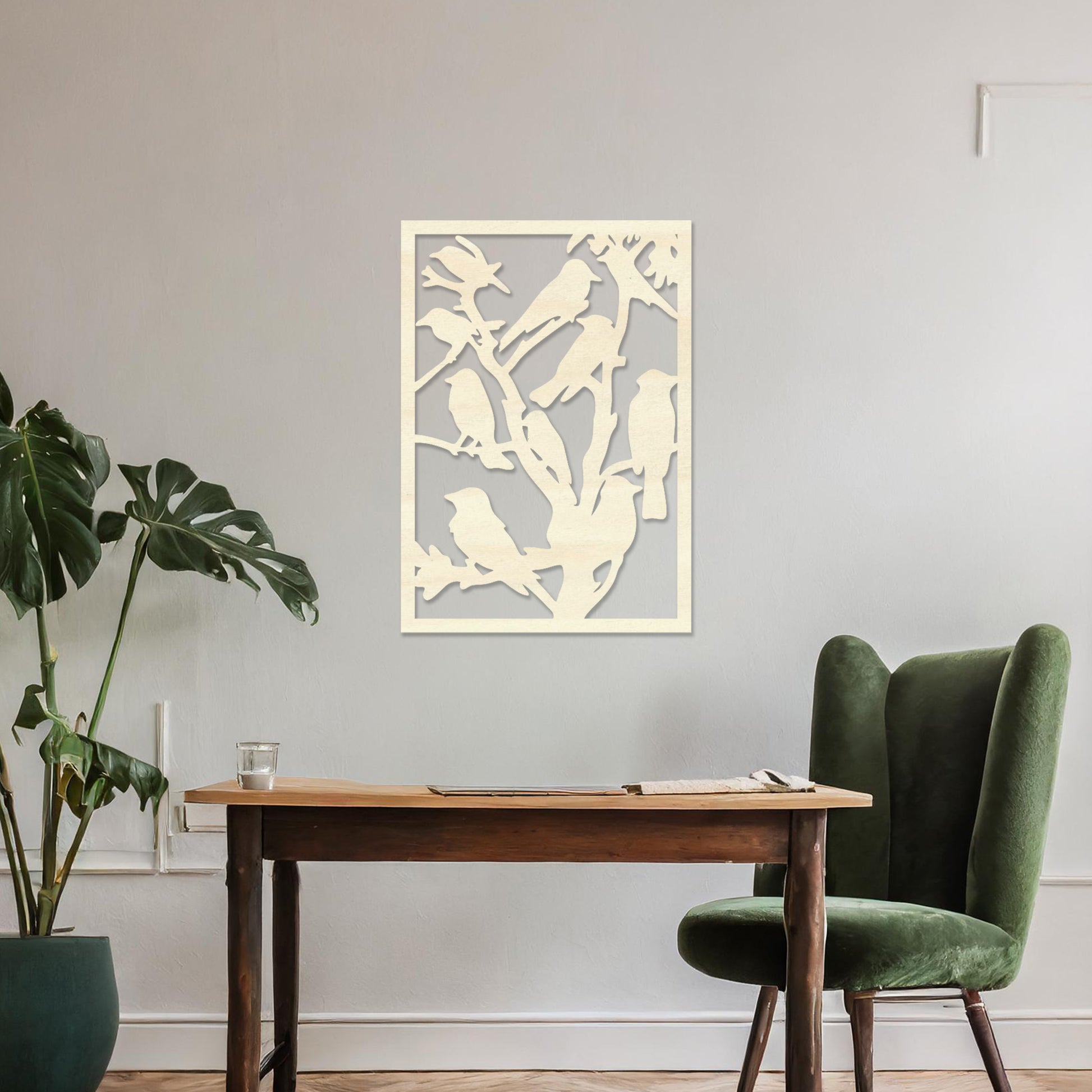 Wooden wall art featuring a detailed design of birds perched on branches. The artwork is displayed on a neutral wall within modern room decor, highlighting the intricate natural pattern.