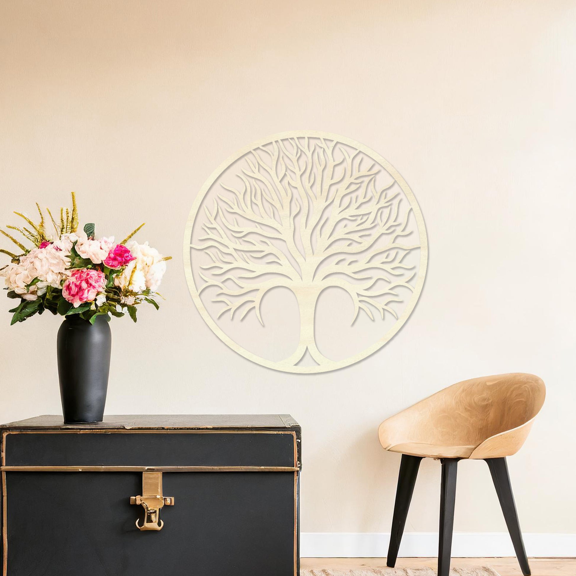 Circular wall art featuring a detailed tree design with spreading branches, symbolising life and growth. This piece is displayed on a neutral wall in a modern room, complementing the elegant and contemporary decor.