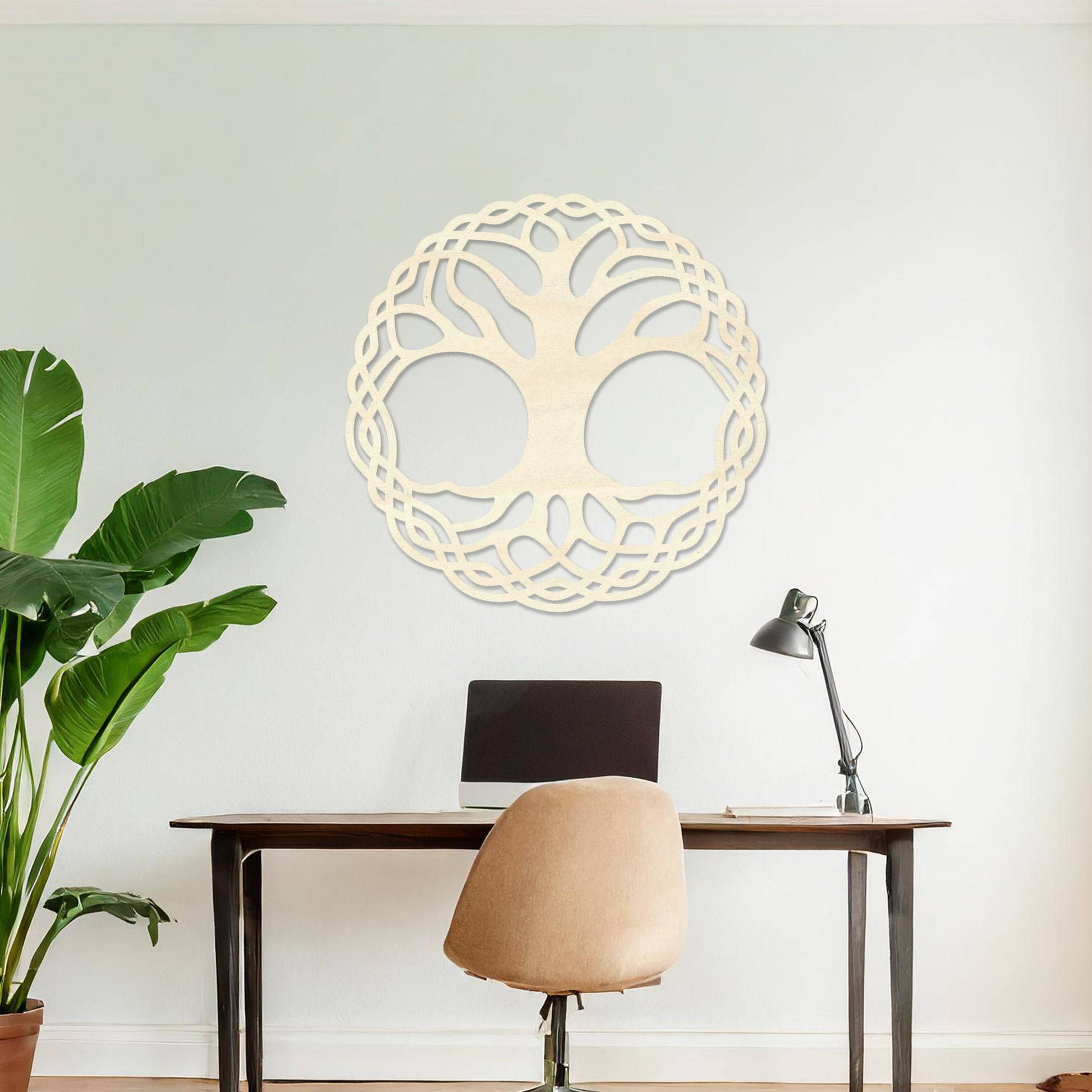 Wooden wall art depicting a circular tree of life design with intertwined roots and branches, placed on a neutral wall within a modern room decor, highlighting its intricate craftsmanship and symbolic aesthetic.