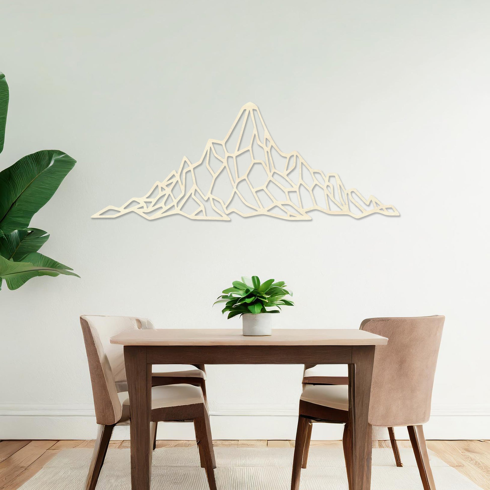 Wooden wall art featuring a geometric mountain range design with angular, interconnected shapes. The artwork is displayed on a neutral wall within modern room decor, emphasising its bold and minimalist aesthetic.