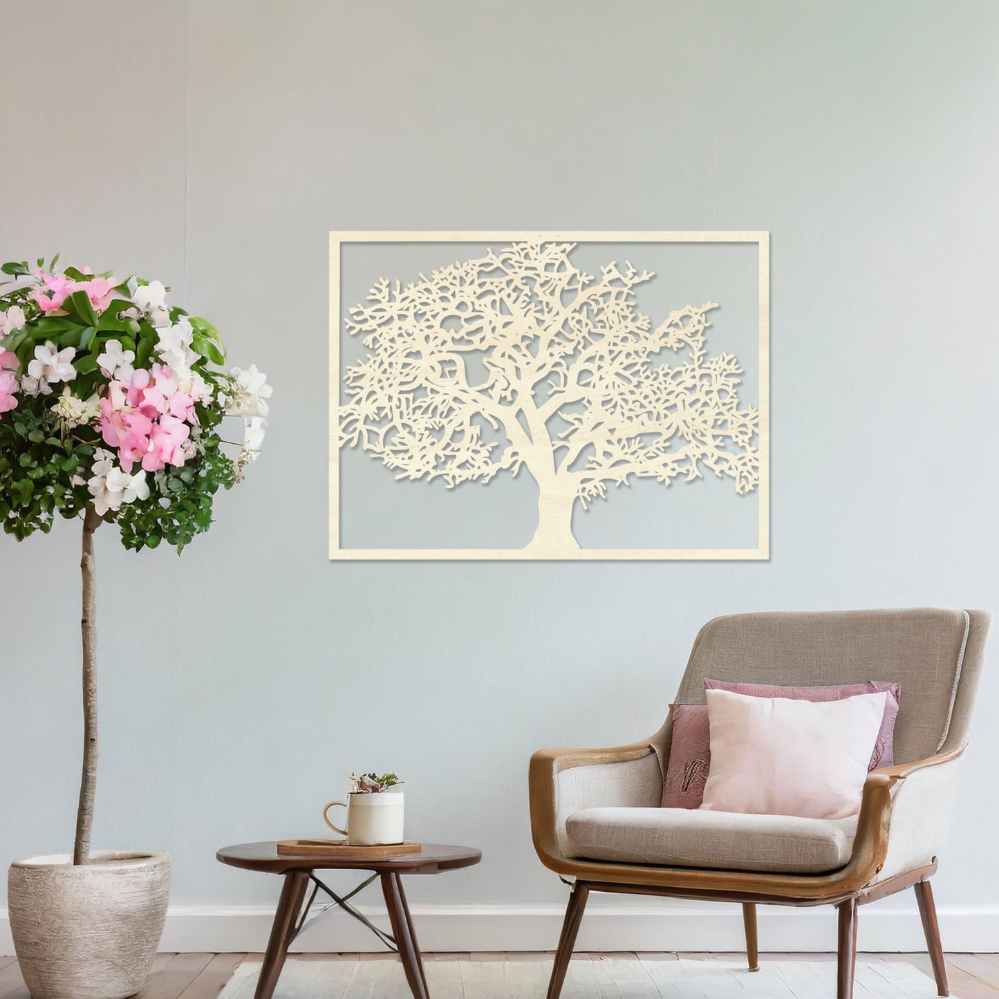 Wooden wall art featuring a rectangular tree design with detailed branches and leaves, displayed on a neutral wall within modern room decor, showcasing its natural and intricate craftsmanship.