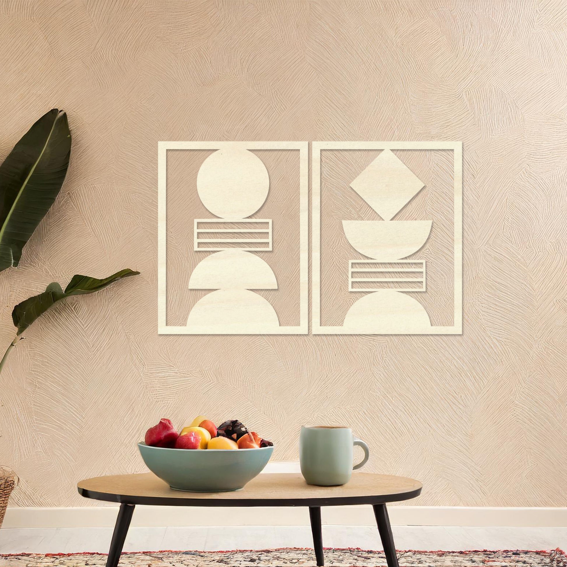 Wall art featuring a set of two geometric abstract designs, each framed with symmetrical shapes and minimalist patterns. The pieces are displayed on a neutral wall within modern room decor, enhancing the contemporary aesthetic.