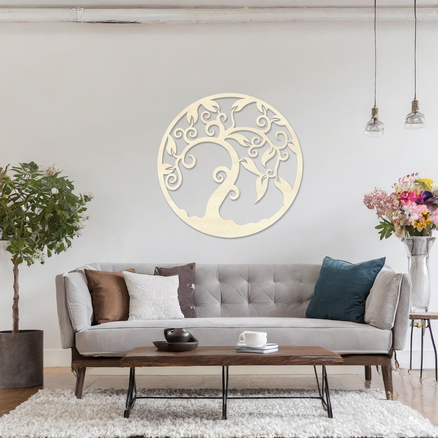 Wooden wall art design featuring a swirling tree with curved branches and leaves, framed in a circular shape, placed on a neutral wall within modern room decor. The design highlights elegant, flowing forms for a peaceful, organic look.