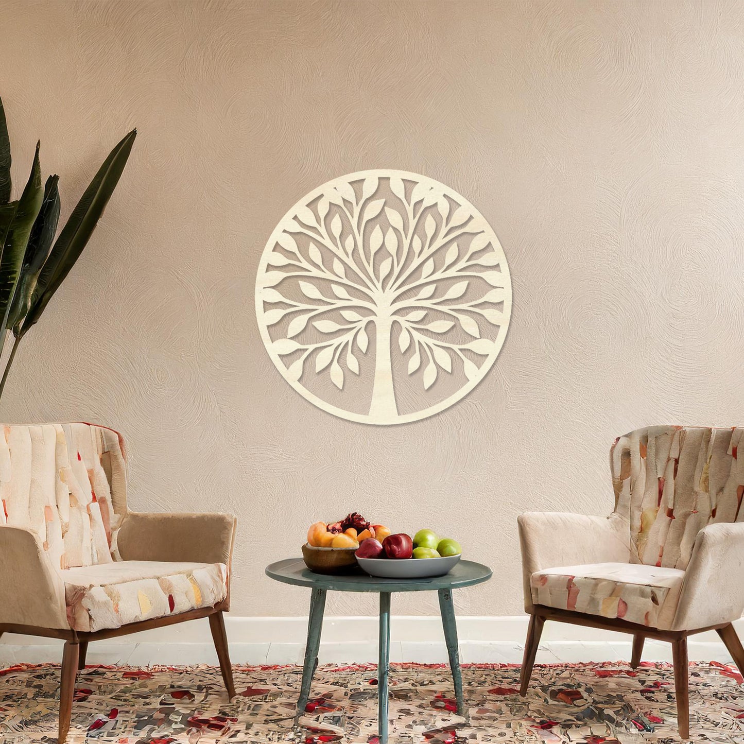 Wooden wall art featuring a circular tree design with stylised leaves and branches, displayed on a neutral wall within modern room decor, highlighting its elegant and nature-inspired craftsmanship.