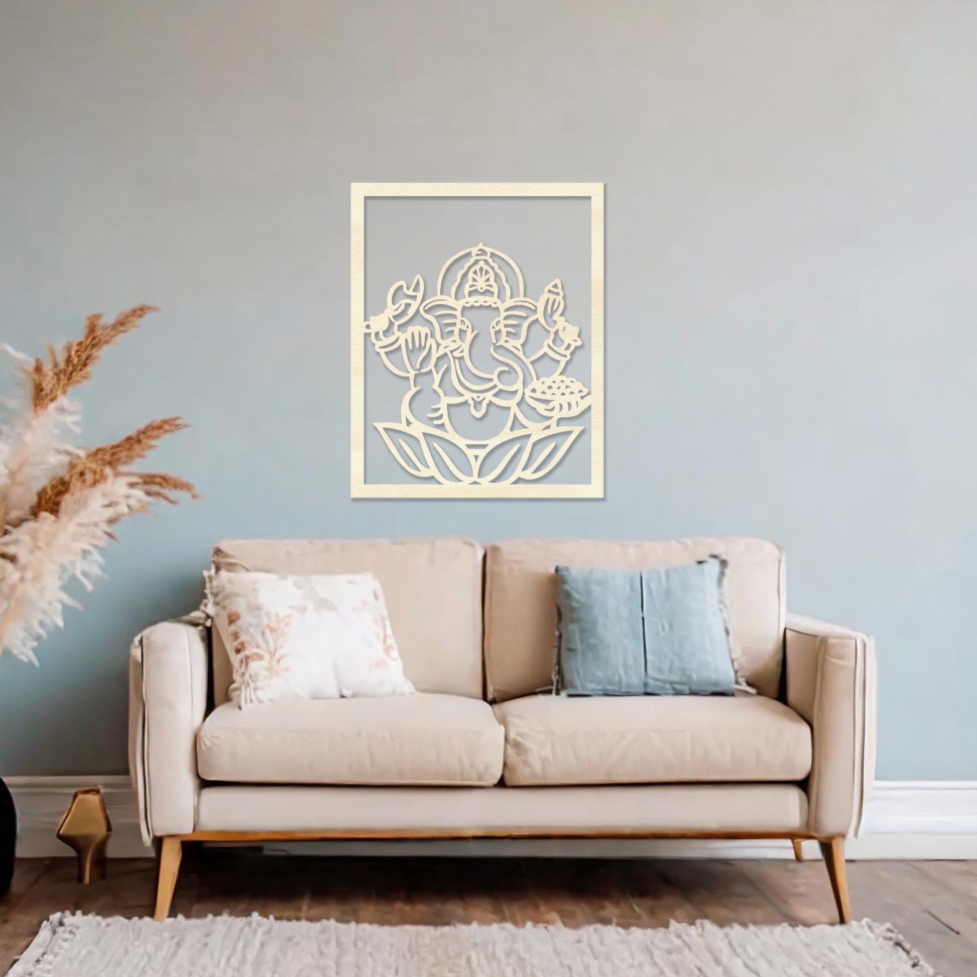 Wooden wall art featuring a framed design of Lord Ganesha sitting on a lotus flower with intricate details. The artwork is displayed on a neutral wall within modern room decor, highlighting its cultural and artistic elegance.
