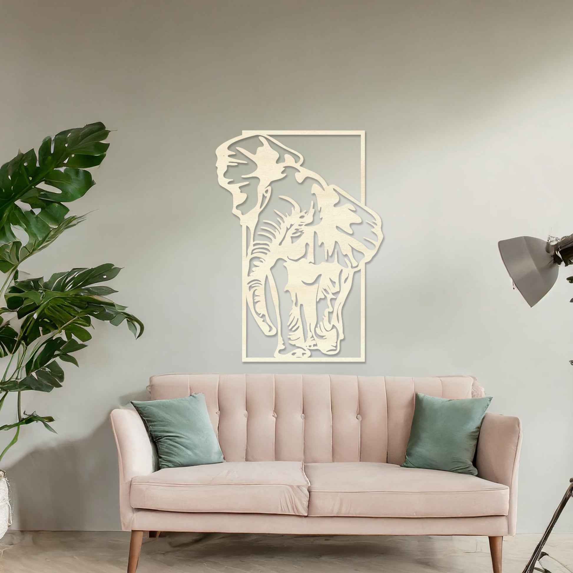 Wooden wall art design featuring a detailed depiction of an elephant, placed on a neutral wall within modern room decor. The design captures the graceful movement of the elephant with intricate outlines and shading.