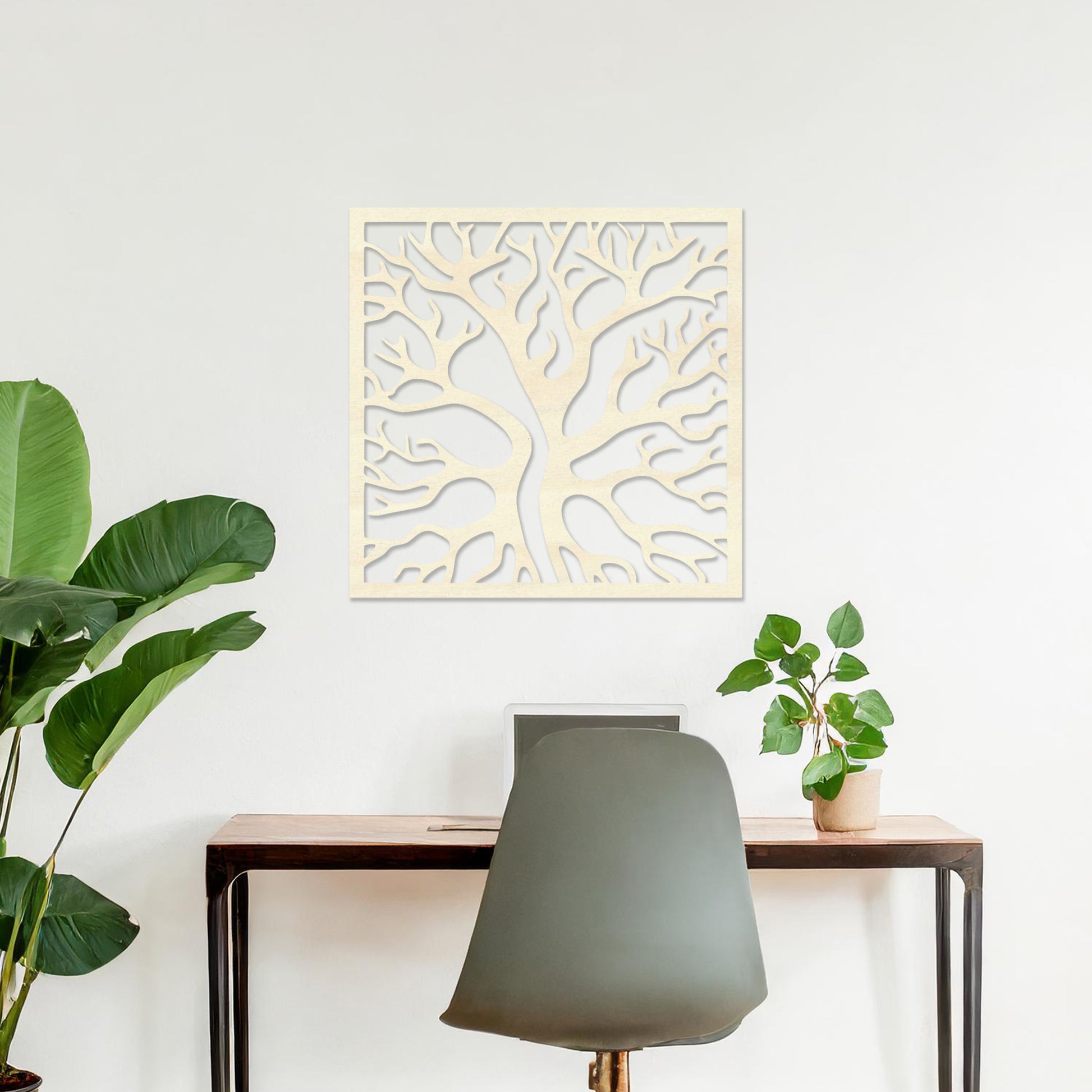 Square wall art featuring a stylised tree with intertwining branches, showcasing a modern and organic design. The artwork is displayed on a neutral wall in a contemporary living room with a sleek sofa and complementary decor.