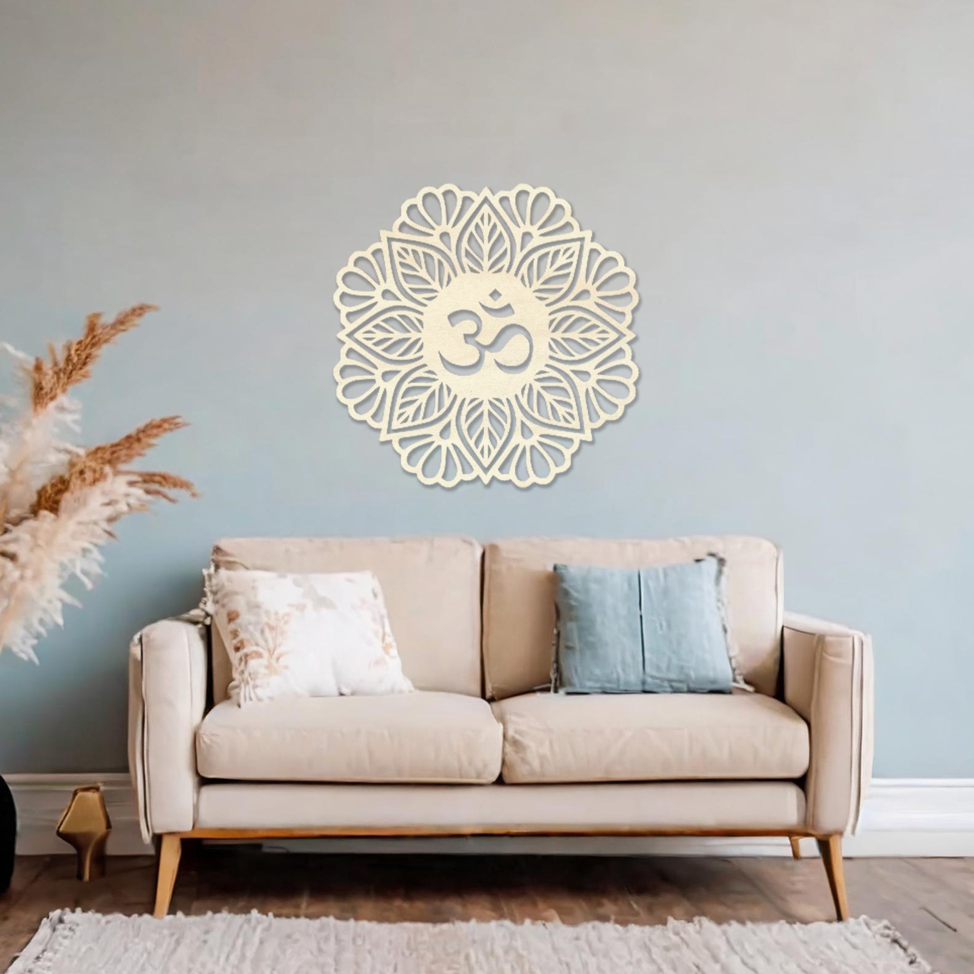 Wooden wall art featuring a mandala design with a central "Om" symbol surrounded by intricate floral and geometric patterns. The artwork is displayed on a neutral wall within modern room decor, highlighting its spiritual and artistic elegance.