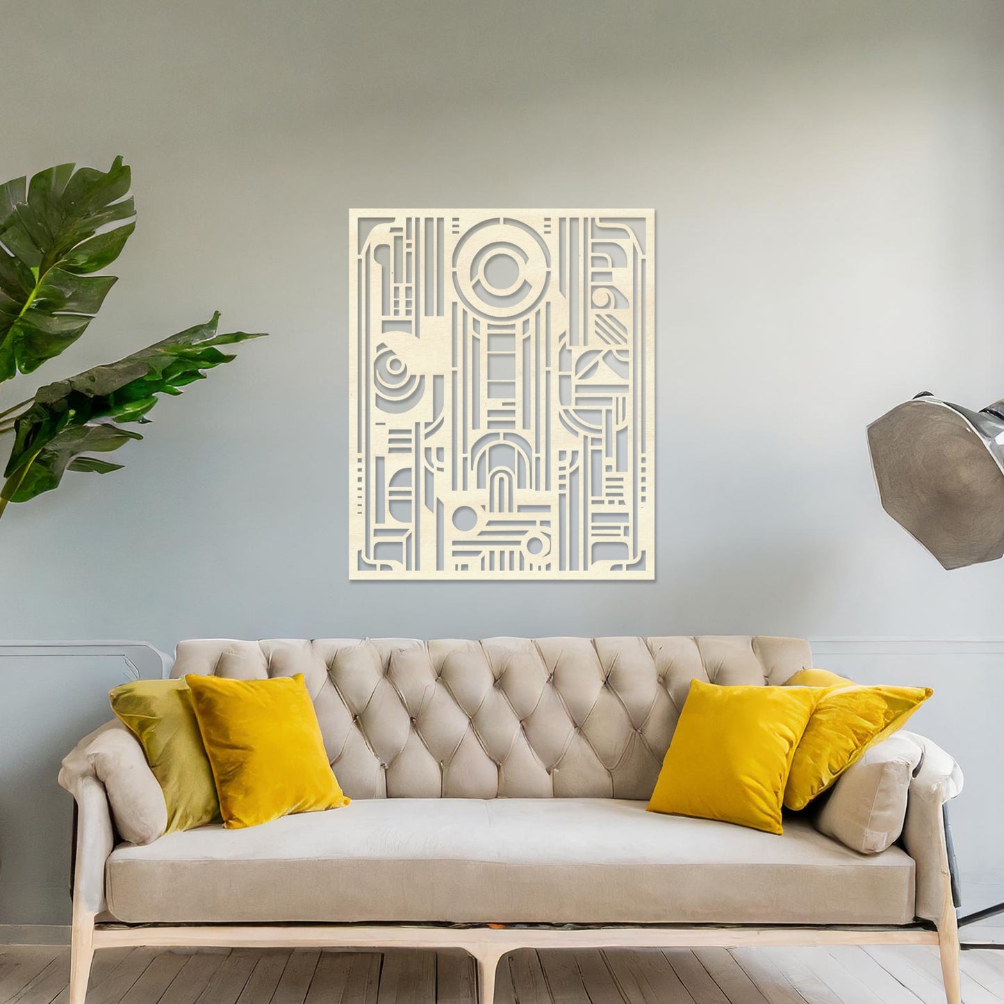 Wall art featuring an abstract geometric design with a combination of circles, lines, and architectural elements. The piece is displayed on a neutral wall within modern decor, adding a bold and contemporary focal point to the space.