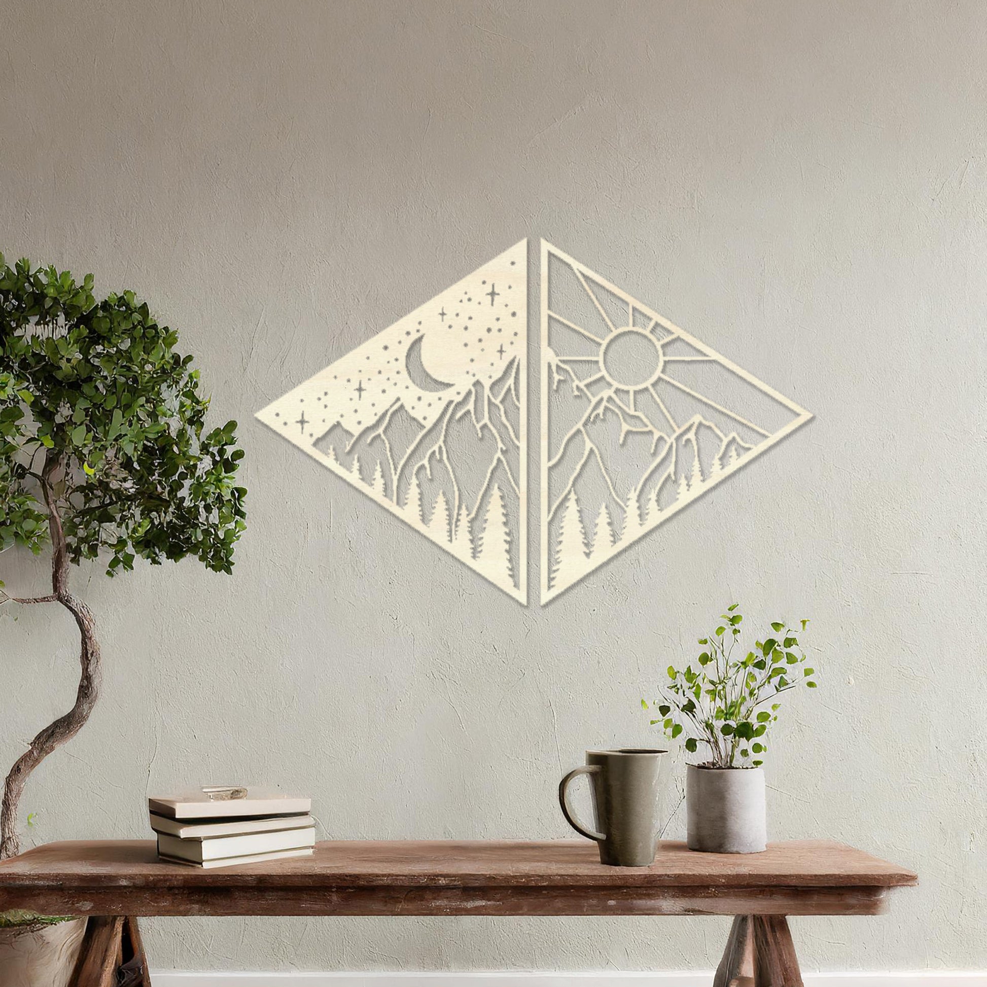 Wooden wall art design featuring a diamond-shaped composition split into two panels: one with a crescent moon and stars over mountains, and the other with a sun above the same landscape, placed on a neutral wall within modern room decor. 