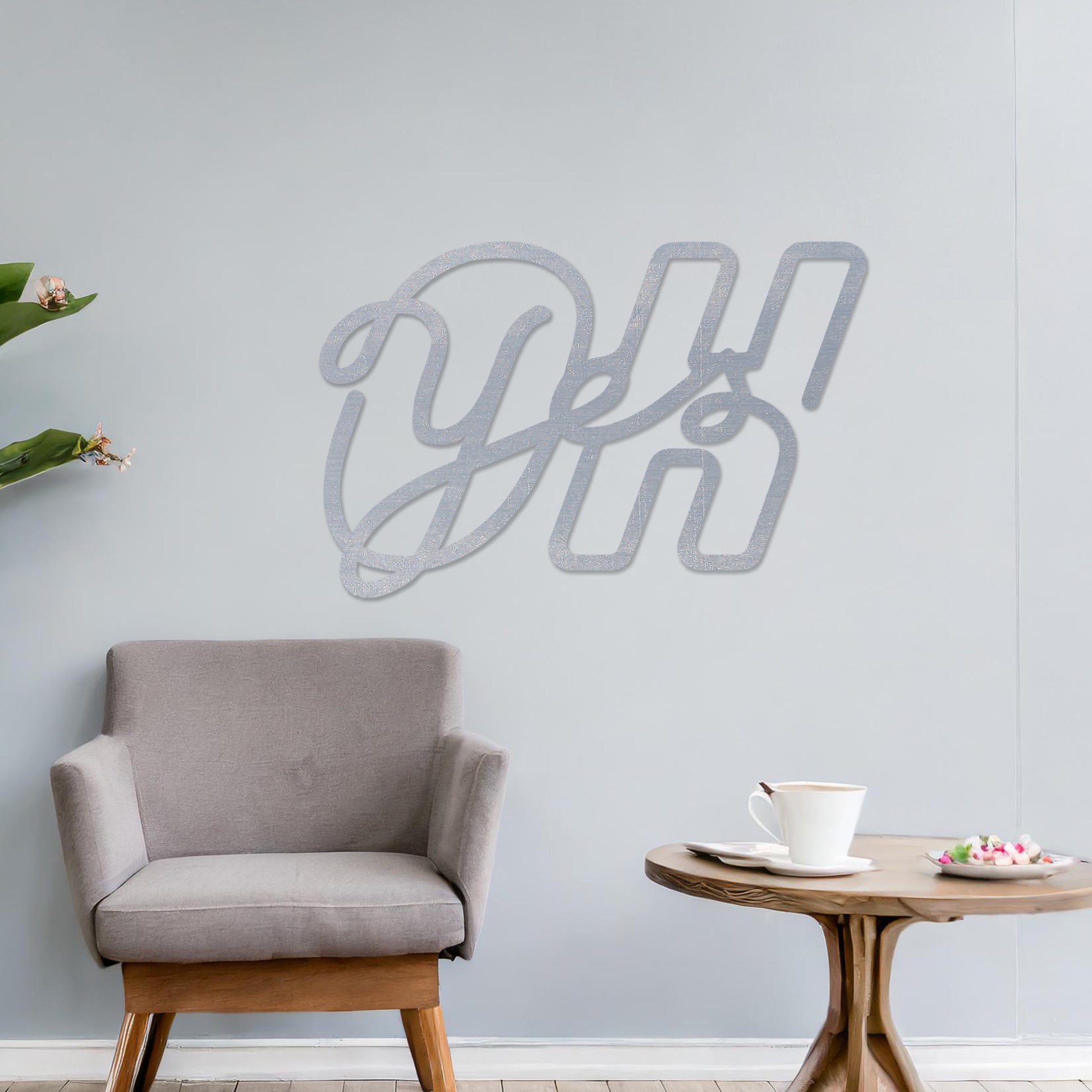 Wall art featuring the phrase "Oh Yes" in an elegant, flowing script combined with bold, block-style letters. The piece is displayed on a neutral wall within modern decor, adding a creative and playful touch to the space.