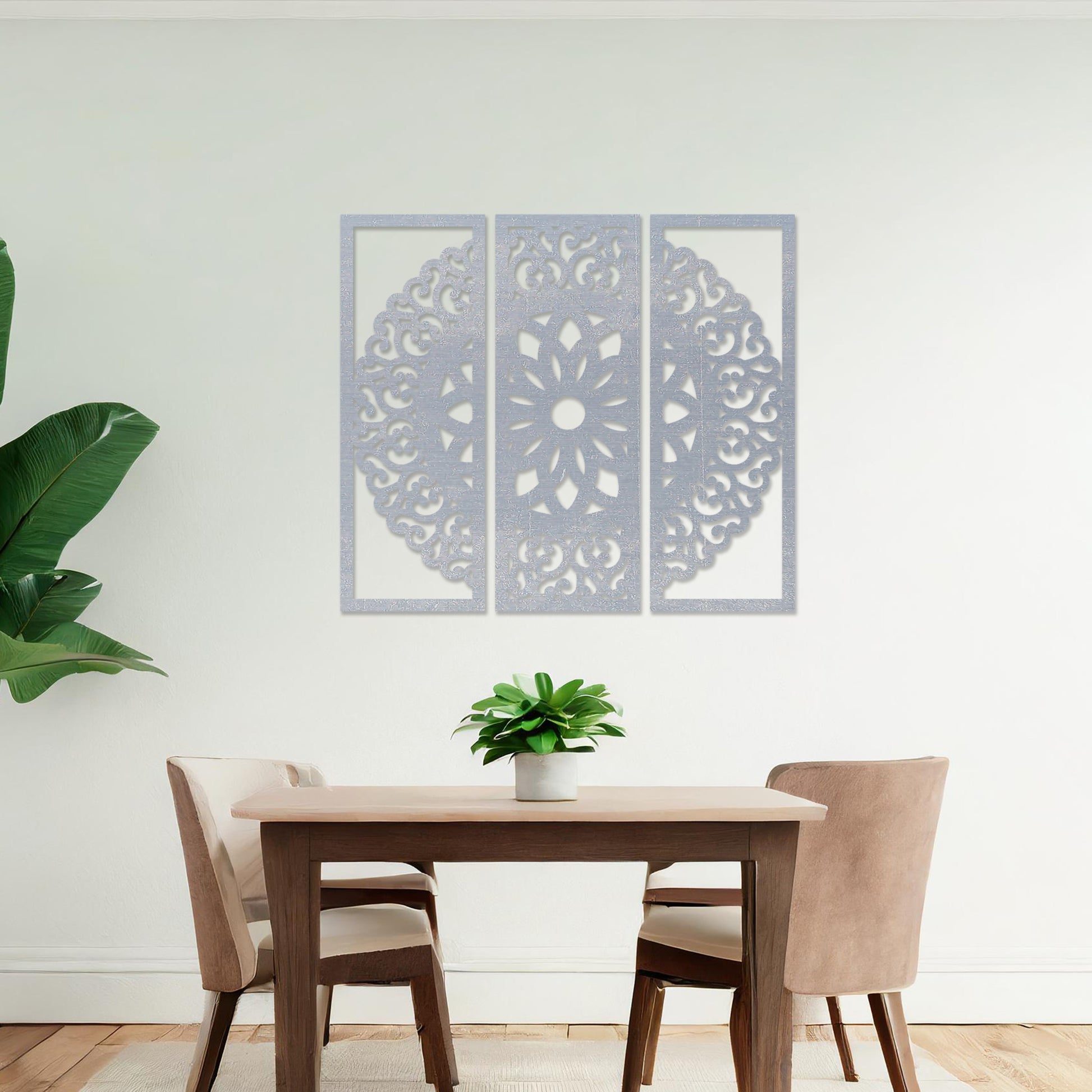 Wall art featuring a triptych design with an intricate mandala pattern framed across three panels. The artwork is displayed on a neutral wall within modern decor, adding a harmonious and decorative element to the space.