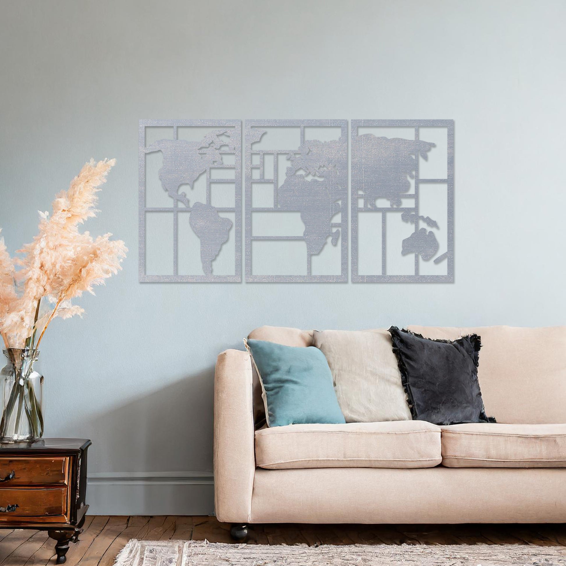 Wooden wall art design featuring a three-panel world map with continents framed in geometric shapes, placed on a neutral wall within elegant room decor. The design blends global geography with a modern, minimalist aesthetic.