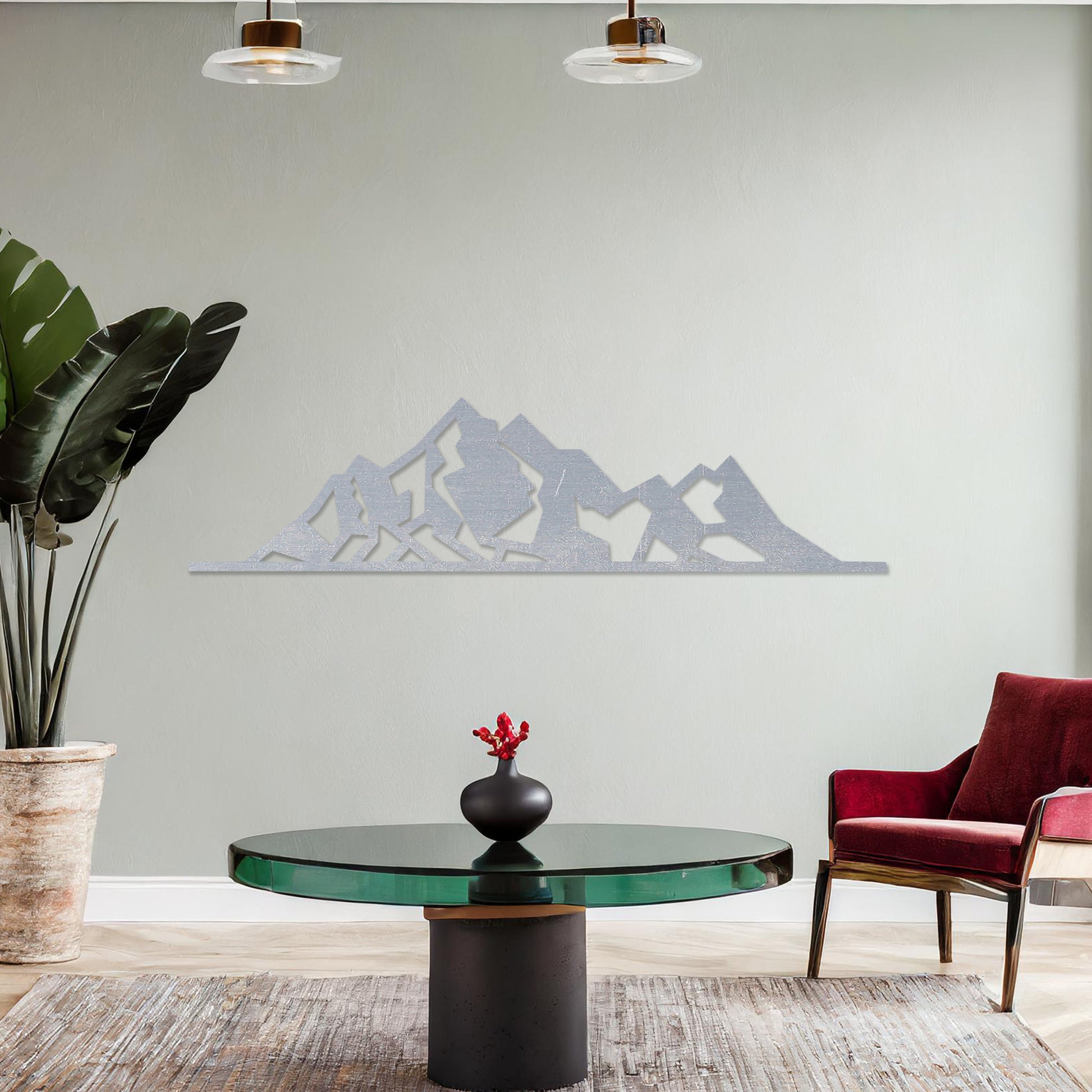 Wall art featuring a minimalist mountain range design with sharp geometric peaks. The piece is displayed on a neutral wall within modern decor, adding a natural and contemporary accent to the space.