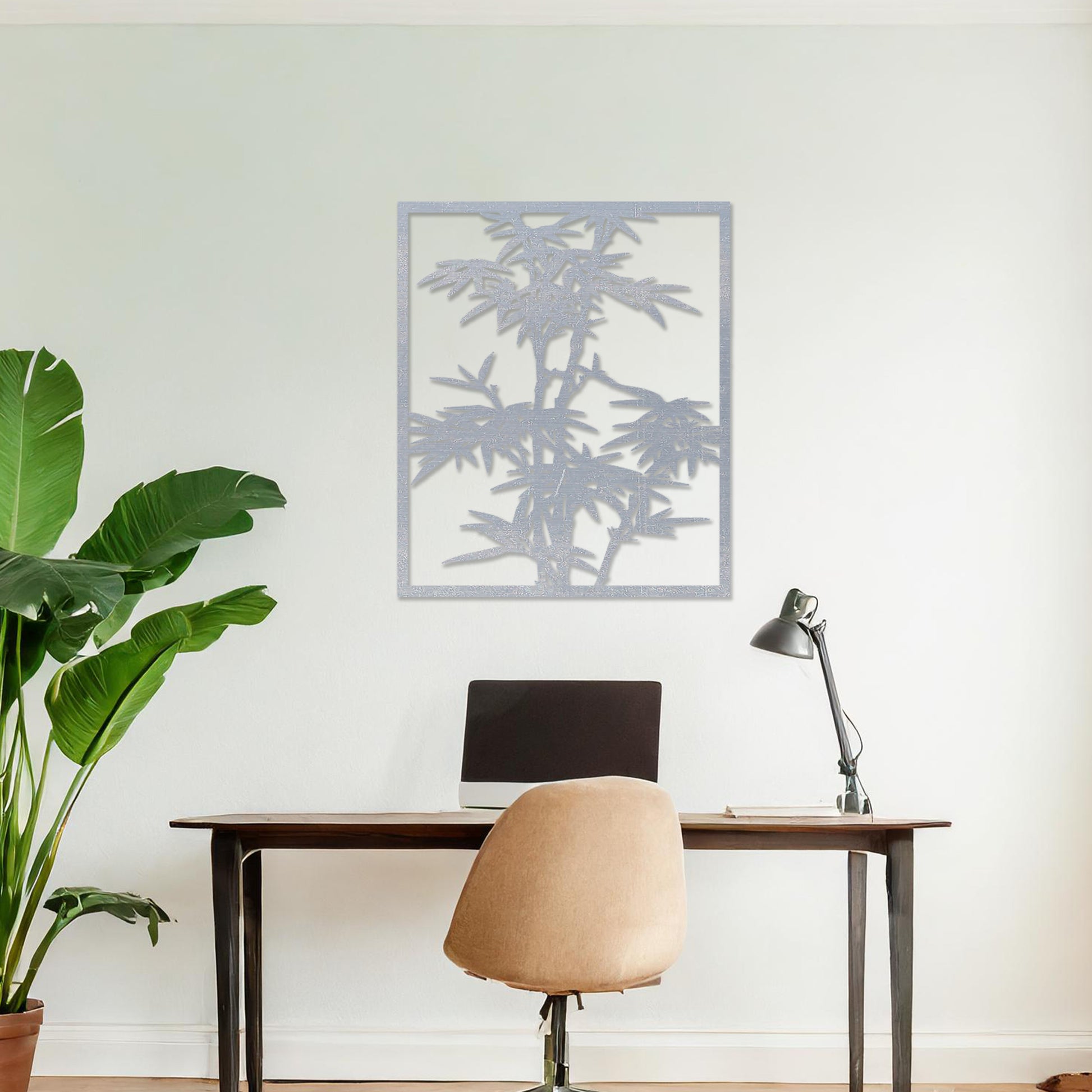 Wooden wall art featuring a rectangular bamboo design with intricate leaves and stalks, displayed on a neutral wall within modern room decor, highlighting its elegant and nature-inspired craftsmanship.