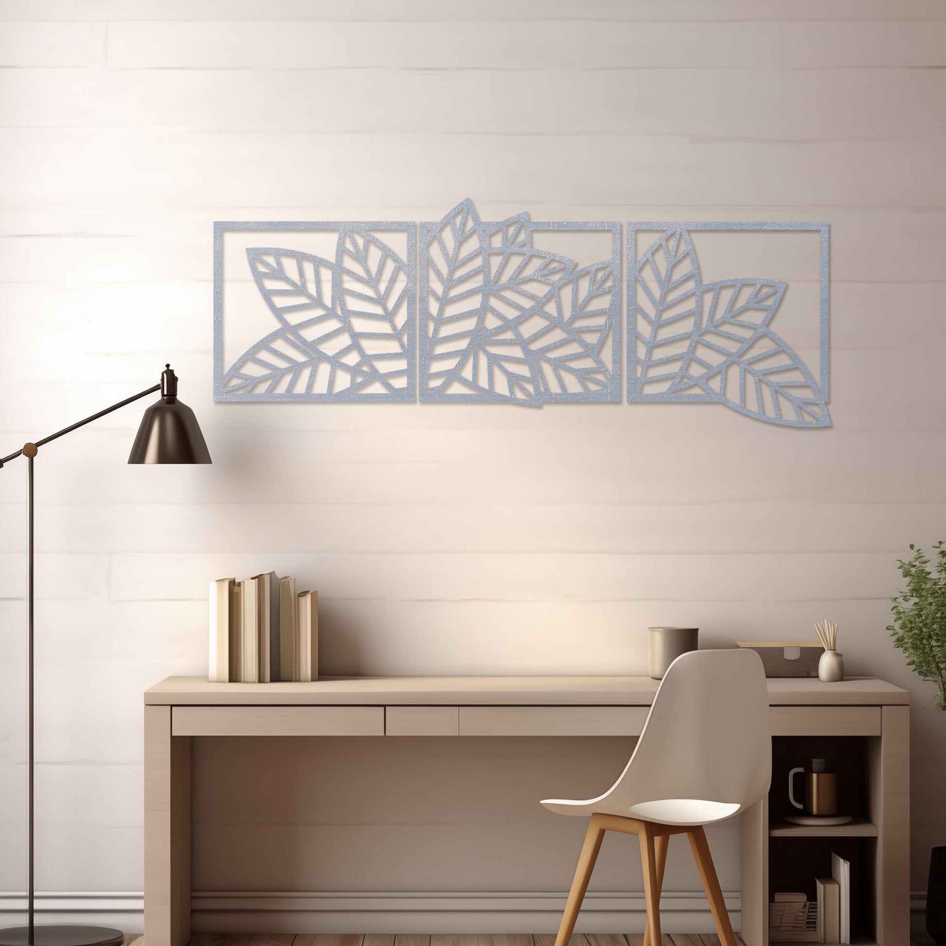 Wooden wall art featuring a three-panel design of overlapping leaf patterns with intricate cut-outs. The artwork is displayed on a neutral wall within modern room decor, highlighting its natural and elegant design.