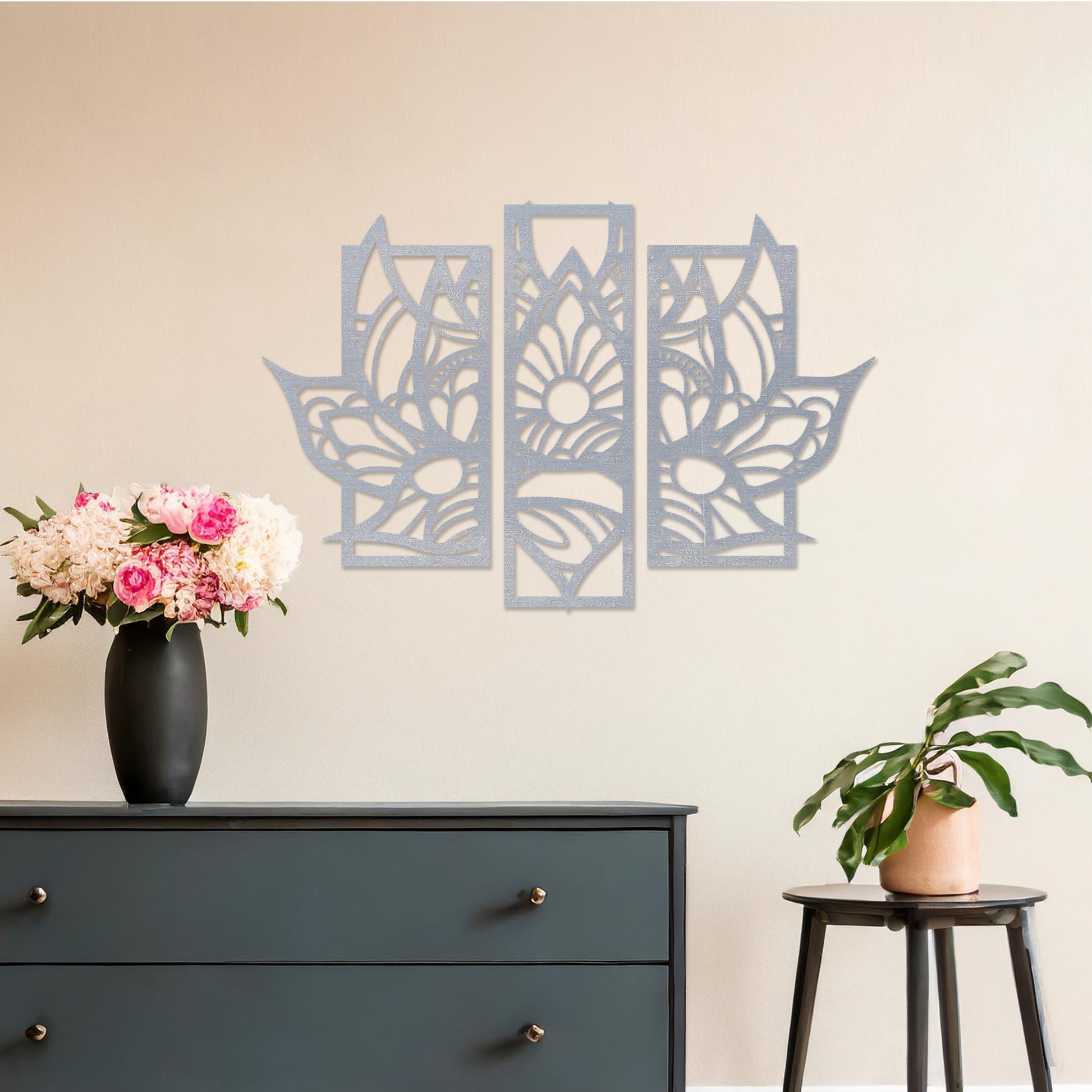Wall art featuring a lotus-inspired floral design in three distinct panels with intricate geometric patterns. The piece is mounted on a neutral wall within modern room decor, adding elegance to the space.