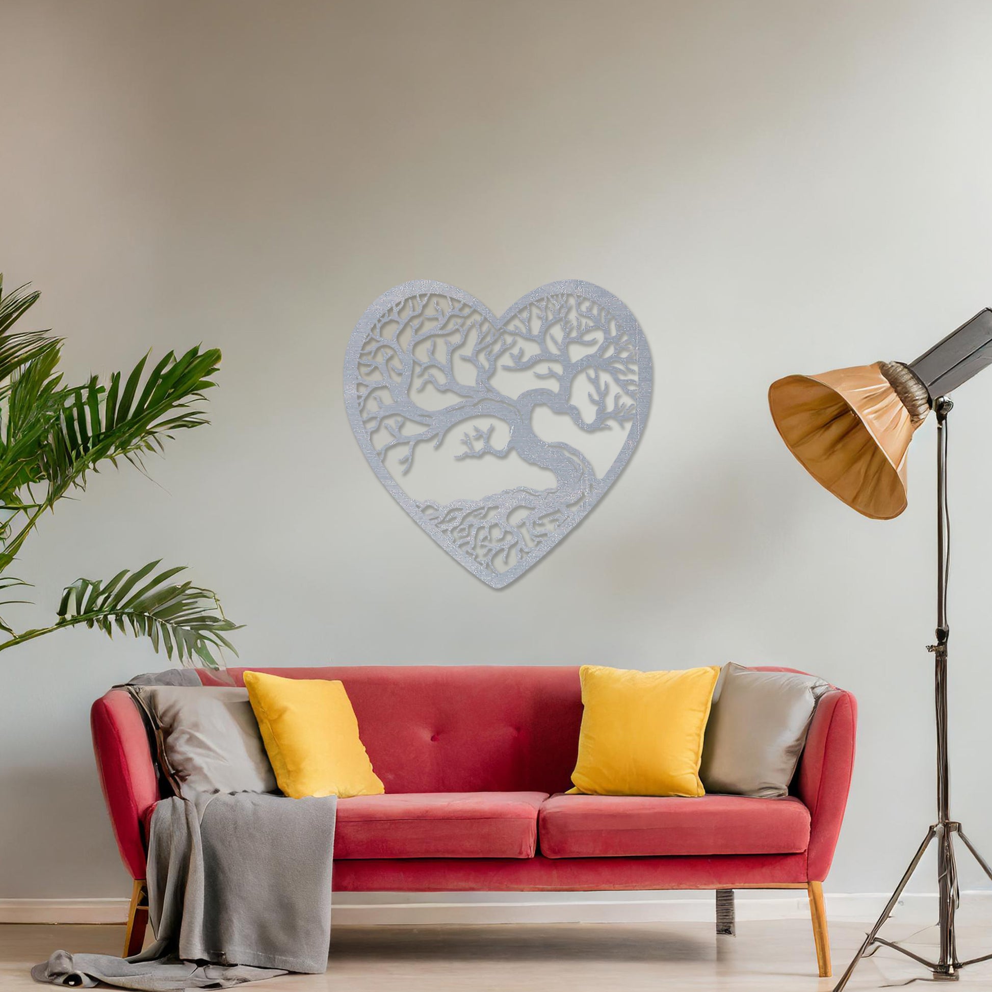 Wooden wall art featuring a heart-shaped design with an intricate tree and branching roots, displayed on a neutral wall within modern room decor, highlighting its natural and artistic craftsmanship.