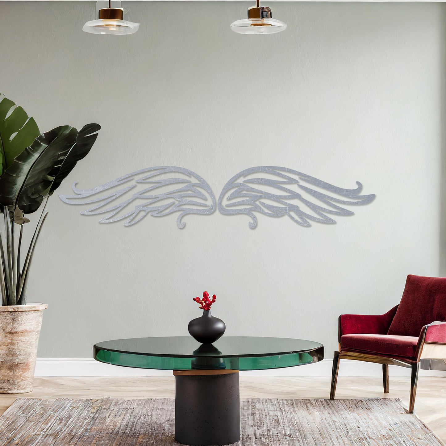 Wall art featuring a pair of intricately designed angel wings with flowing lines and graceful curves. The piece is displayed on a neutral wall within modern decor, adding a symbolic and elegant touch to the setting.