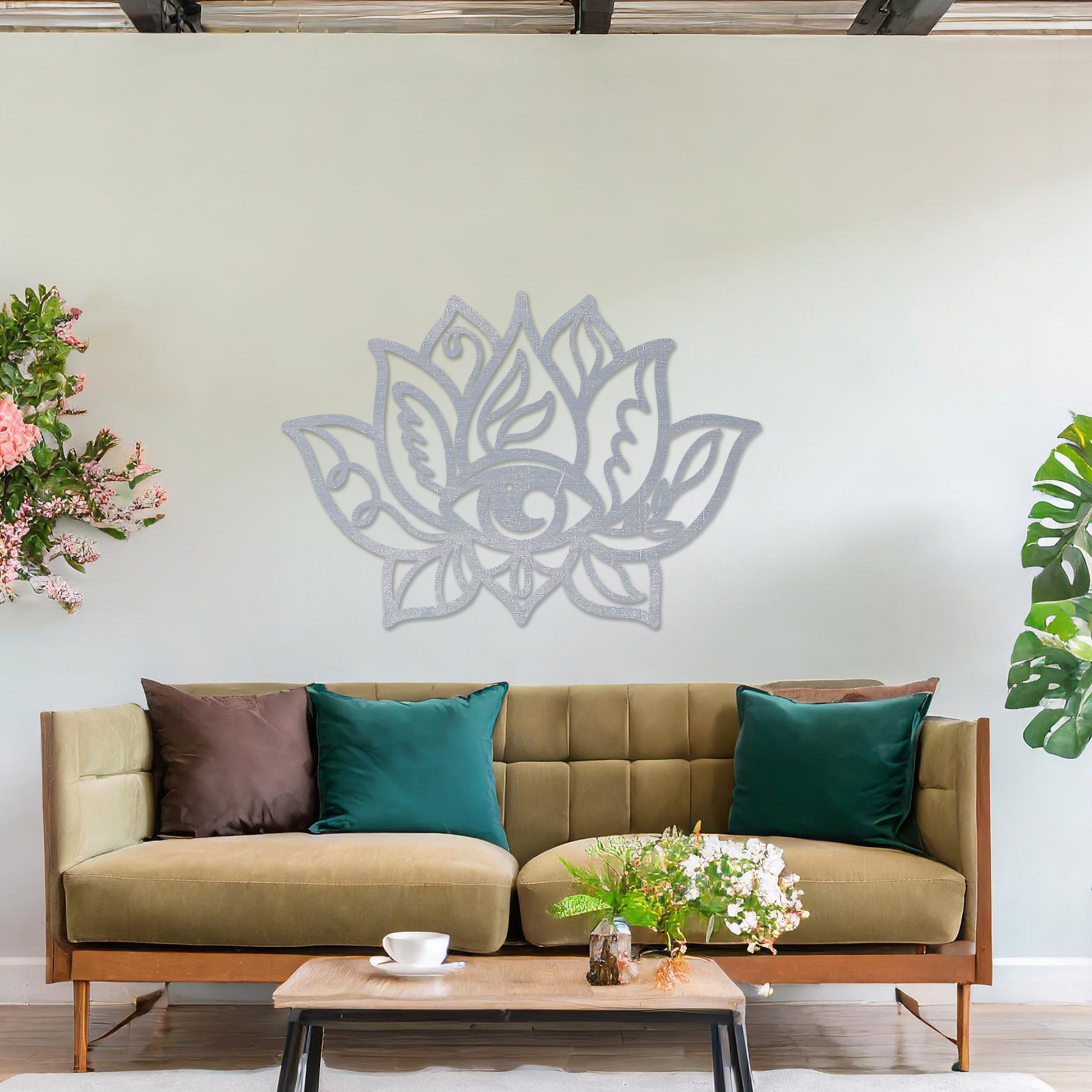 Wooden wall art featuring a lotus flower design with an eye motif at its centre and intricate detailing. The artwork is displayed on a neutral wall within modern room decor, highlighting its symbolic and artistic appeal.