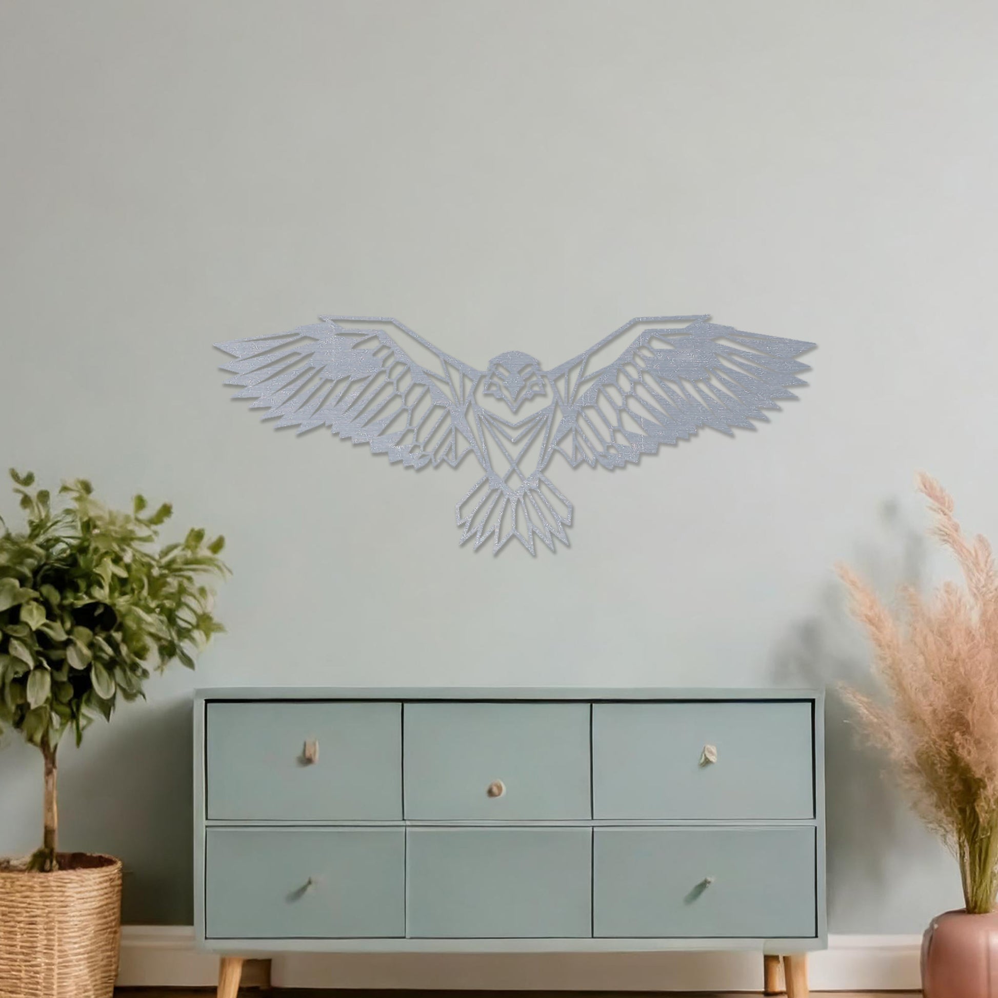 Wooden wall art showcasing a geometric eagle design with outstretched wings, displayed on a neutral wall within modern room decor, highlighting its bold and intricate craftsmanship.