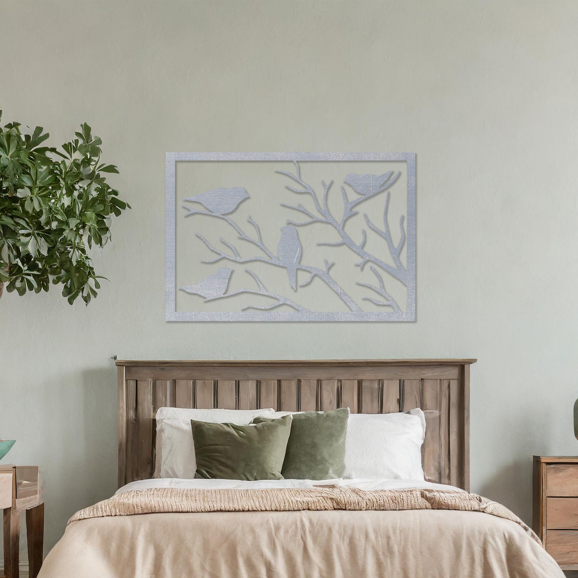 Wooden wall art featuring a rectangular design with birds perched on tree branches, displayed on a neutral wall within modern room decor, highlighting its elegant and nature-inspired craftsmanship.