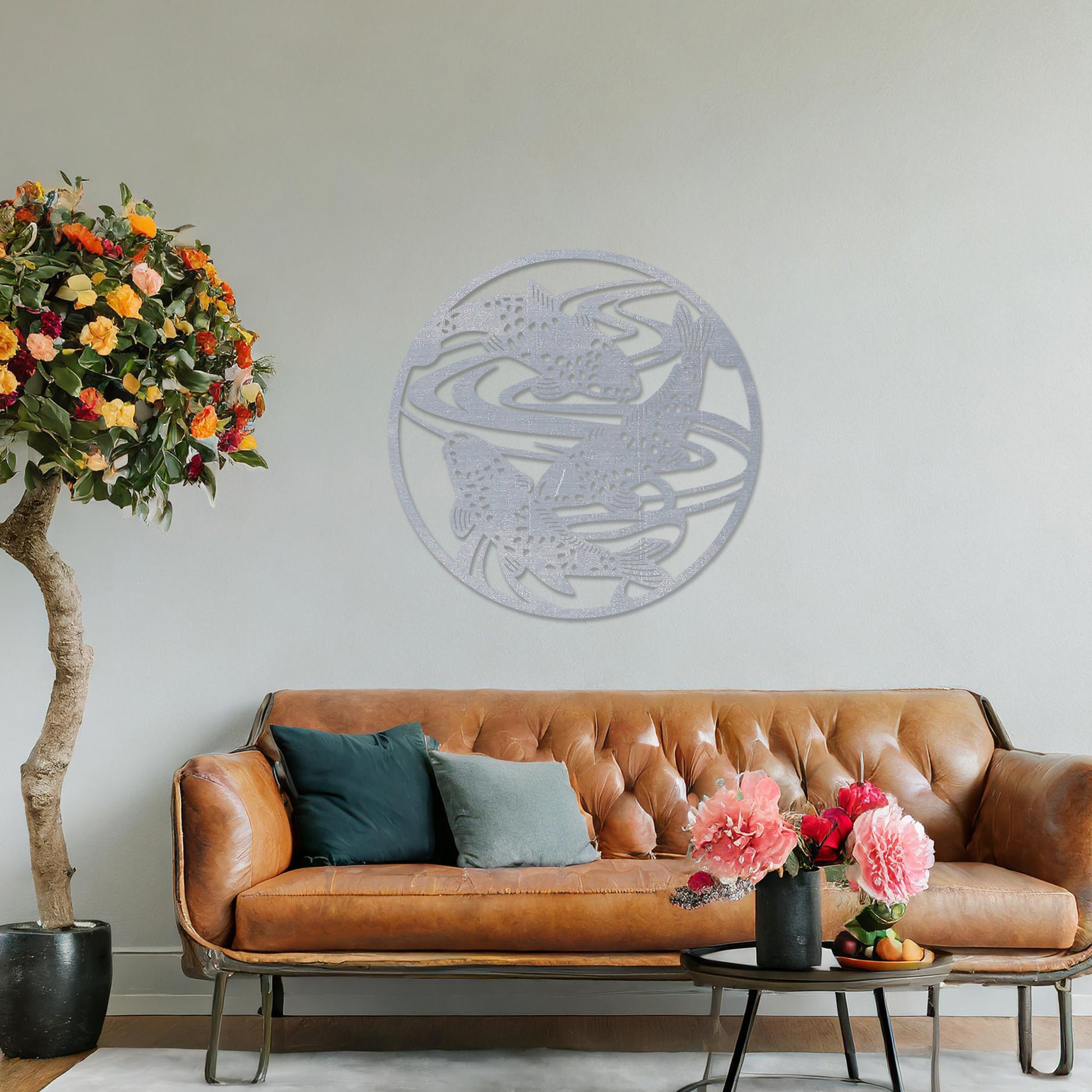 Wooden wall art design featuring koi fish swimming in circular patterns, framed in a round shape, placed on a neutral wall within modern room decor. The design evokes tranquility and movement with its elegant depiction of nature.