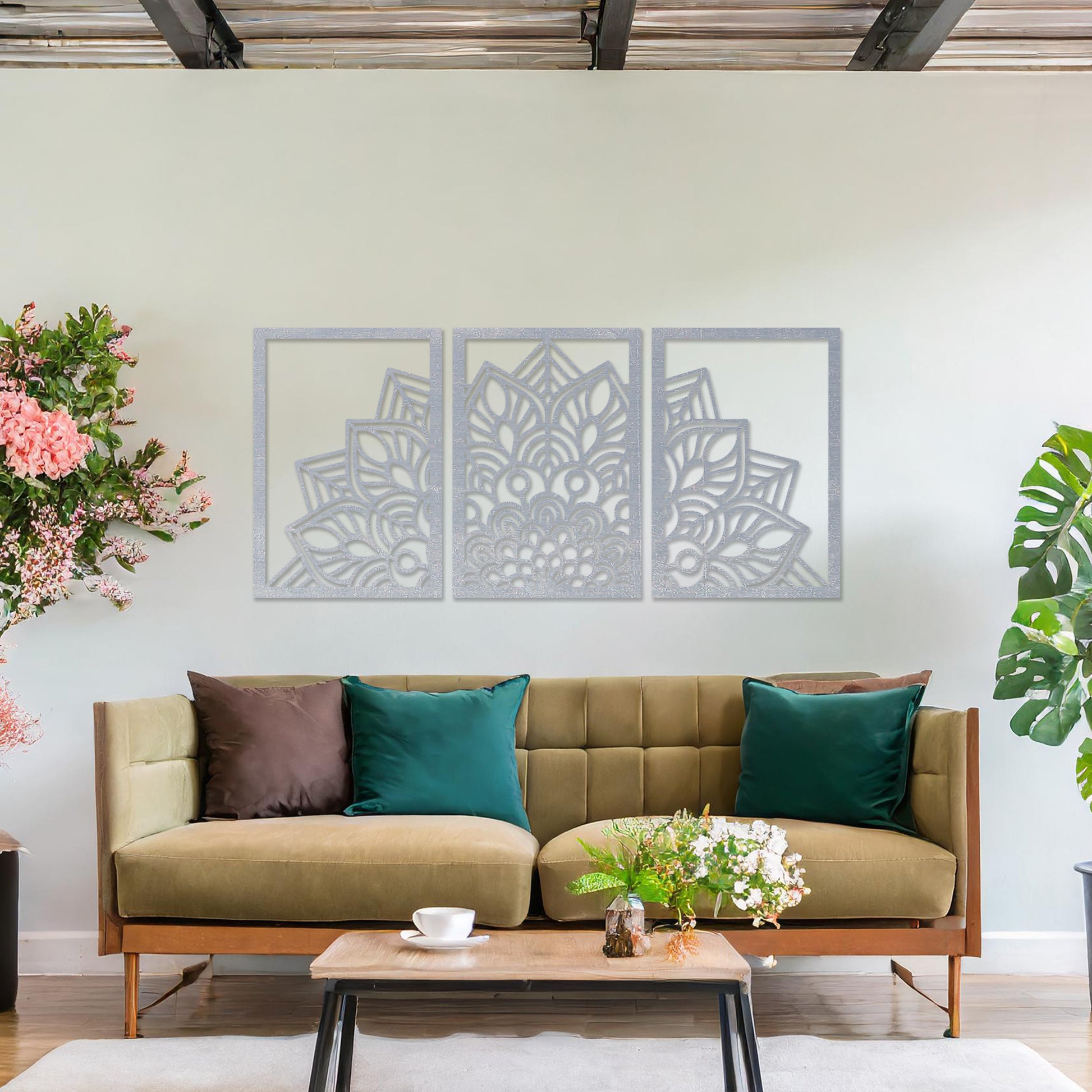 Wall art featuring a triptych design with an intricate mandala pattern spread across three panels. The artwork is displayed on a neutral wall within modern room decor, adding a harmonious and decorative touch to the setting.