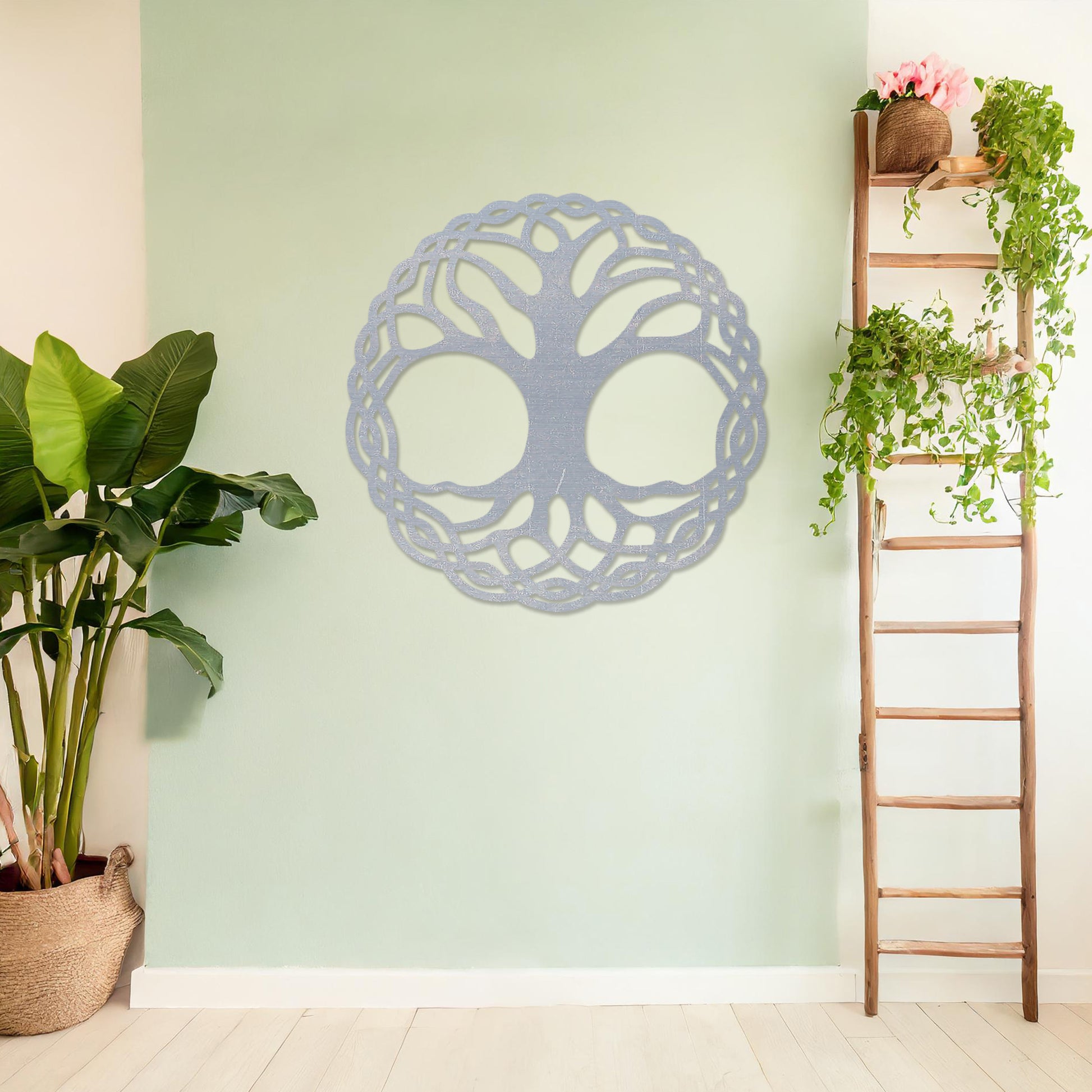 Wooden wall art depicting a circular tree of life design with intertwined roots and branches, placed on a neutral wall within a modern room decor, highlighting its intricate craftsmanship and symbolic aesthetic.