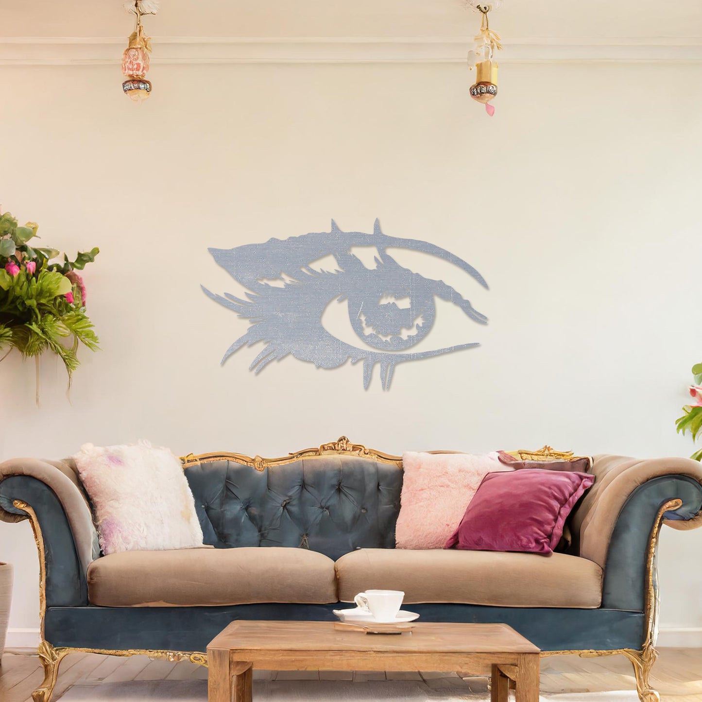 Wooden wall art featuring a stylised eye design with intricate detailing of lashes and bold lines. The artwork is displayed on a neutral wall within modern room decor, emphasising its artistic and striking pattern.