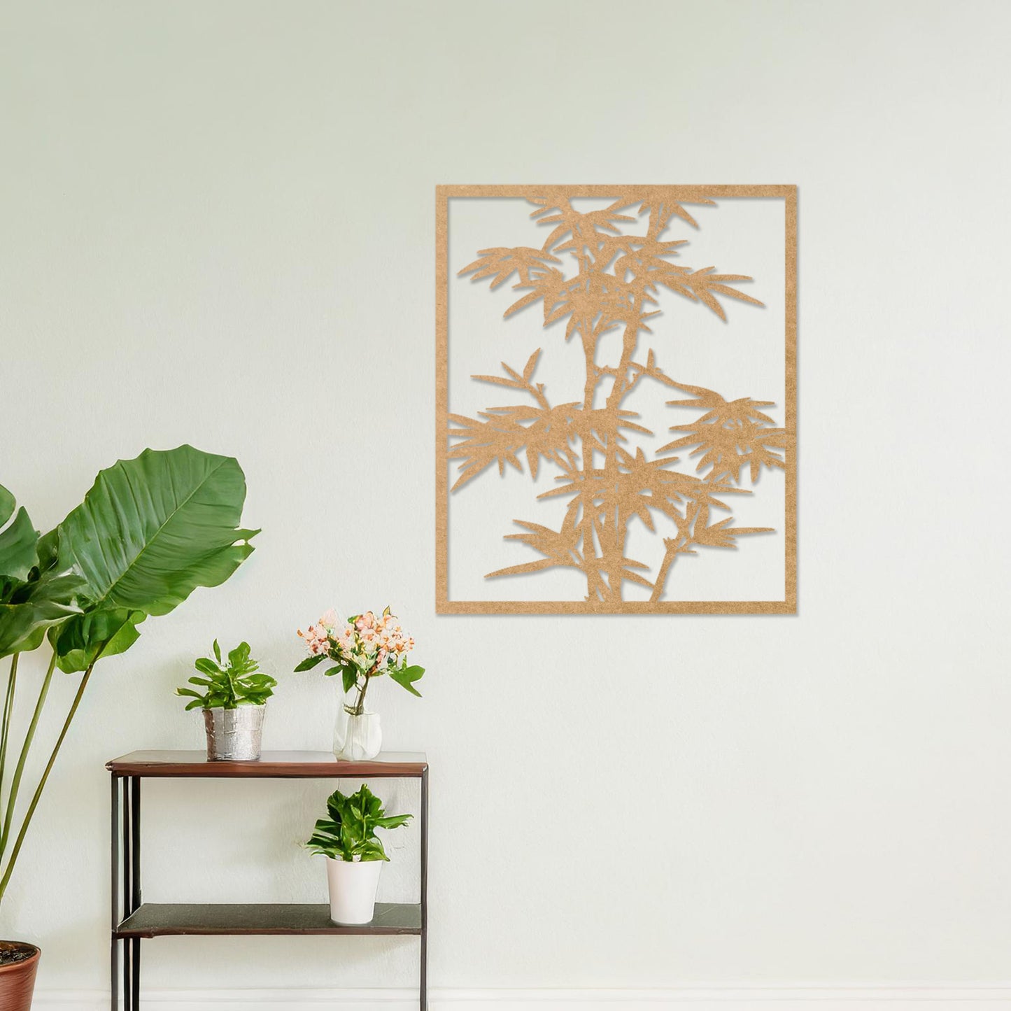 Wooden wall art featuring a rectangular bamboo design with intricate leaves and stalks, displayed on a neutral wall within modern room decor, highlighting its elegant and nature-inspired craftsmanship.